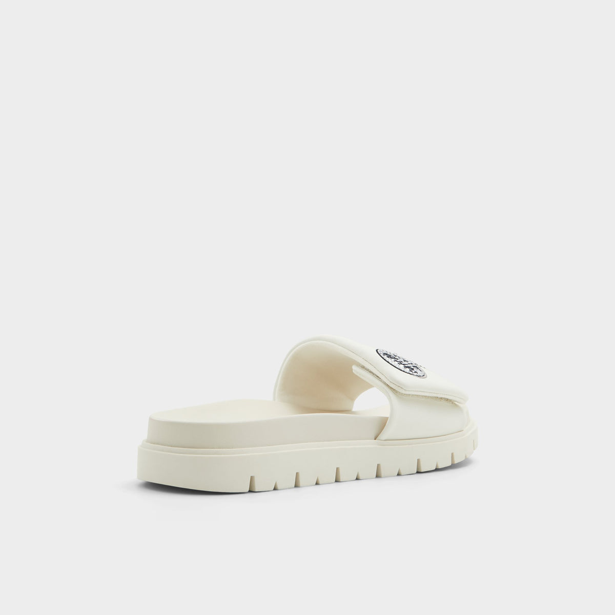 Three-quarter angle of White Ltslides Looney Tunesâ¢ x ALDO's back side