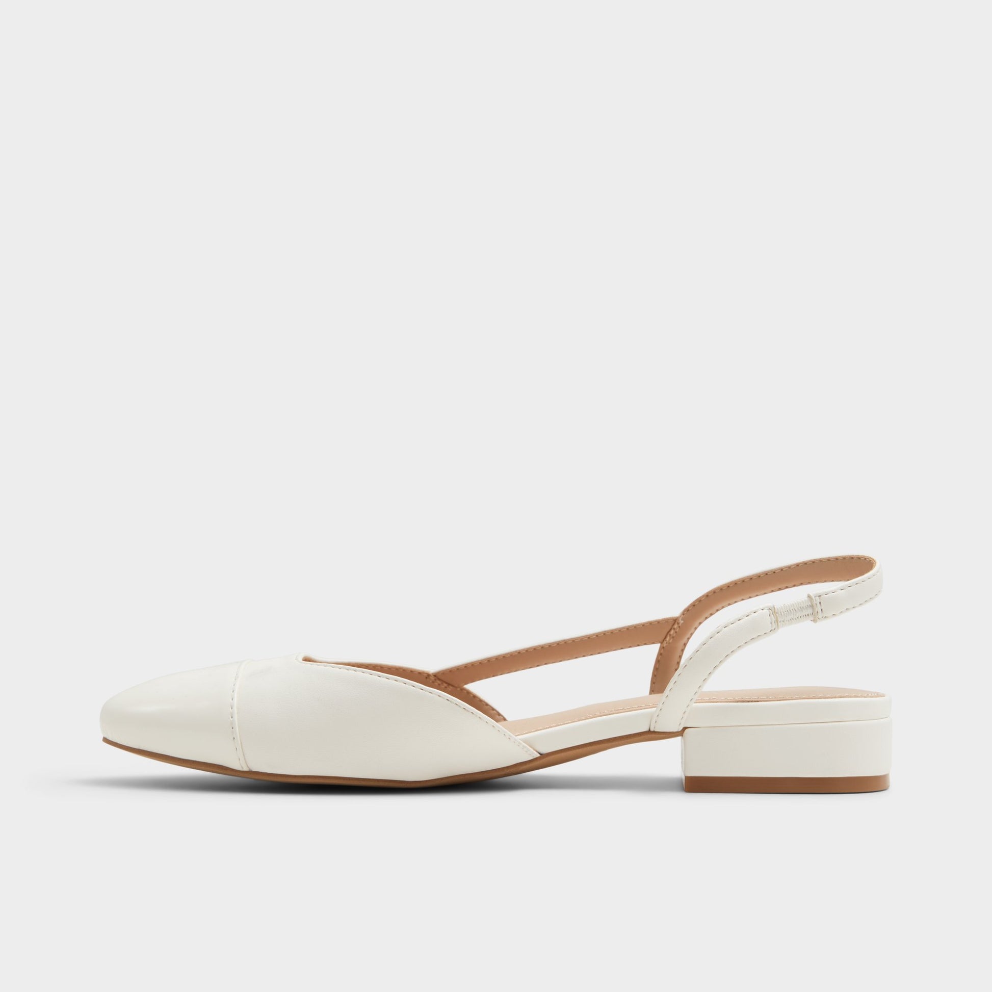 Side view of White Clementinne Sling back high heel