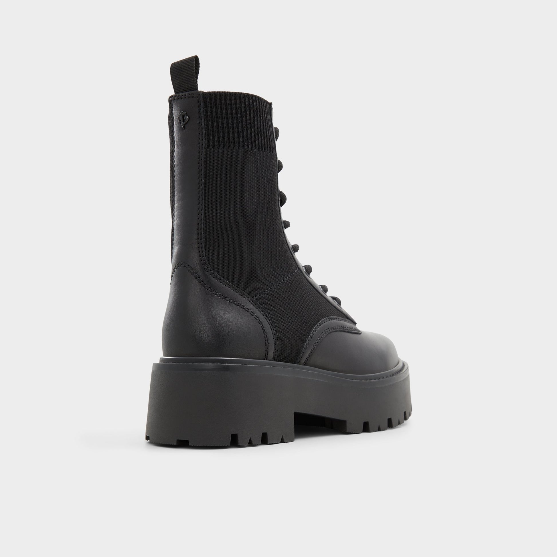 Three-quarter angle of Black Talaleryknit Combat ankle boot's back side