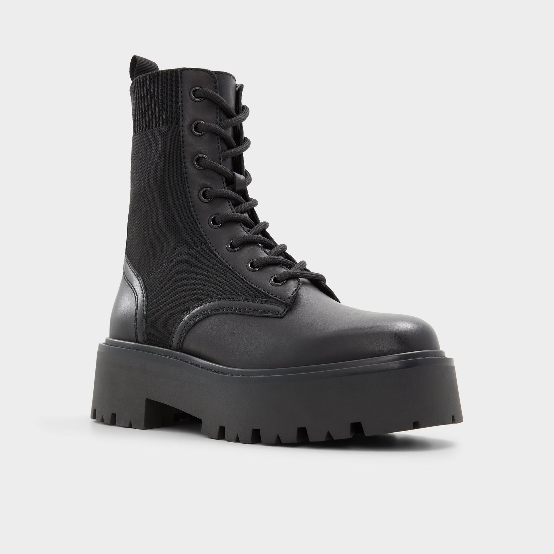 Three-quarter angle of Black Talaleryknit Combat ankle boot's front side