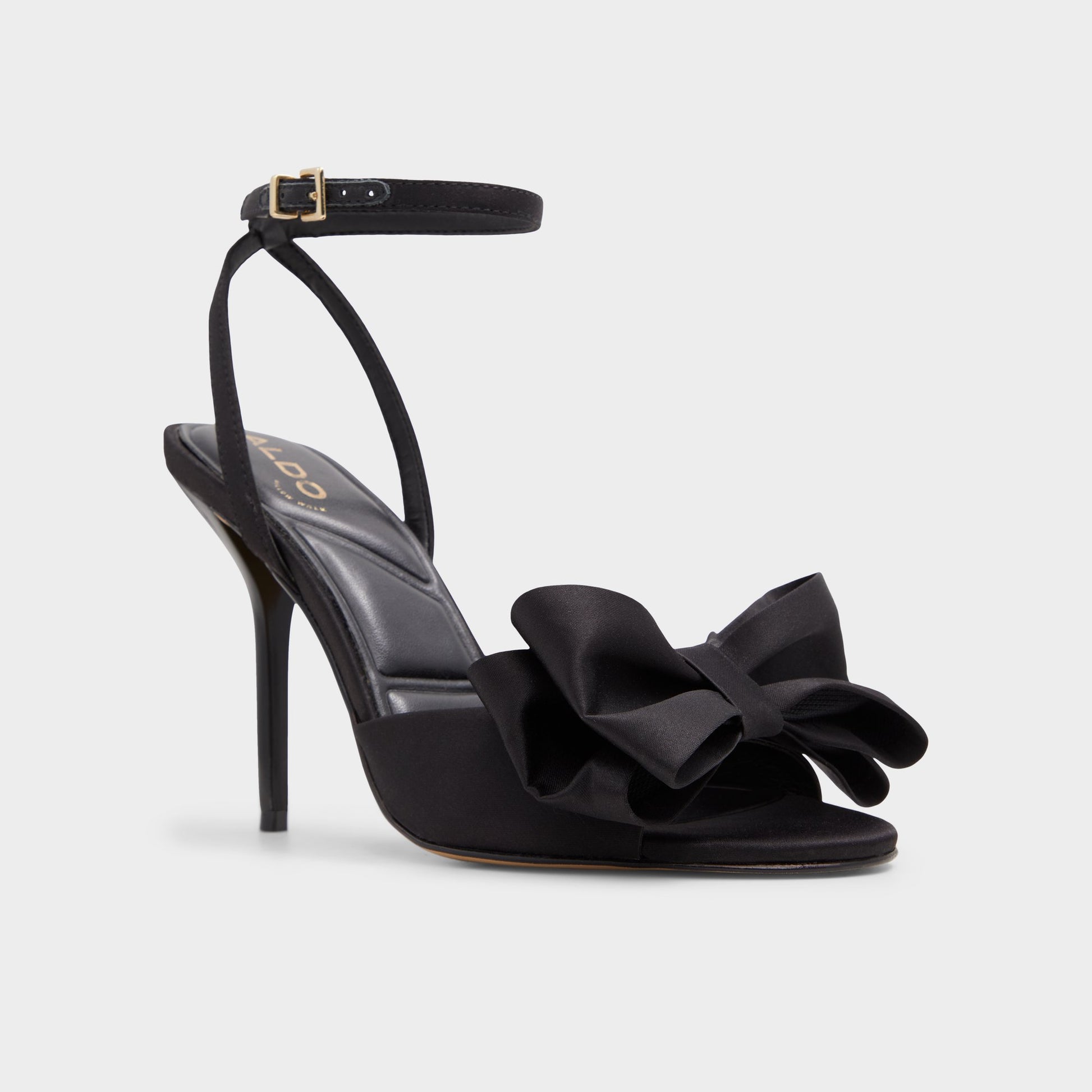 Three-quarter angle of Black Tinsletta Strappy heeled sandal's front side