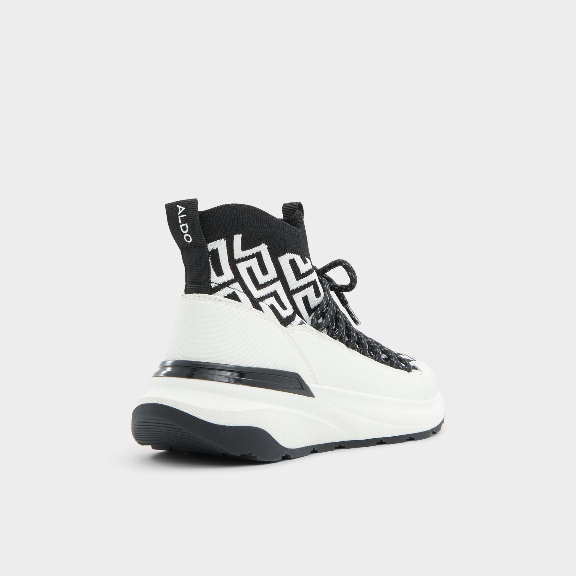 Three-quarter angle of White/Black Everlynn Jogger sneaker's back side