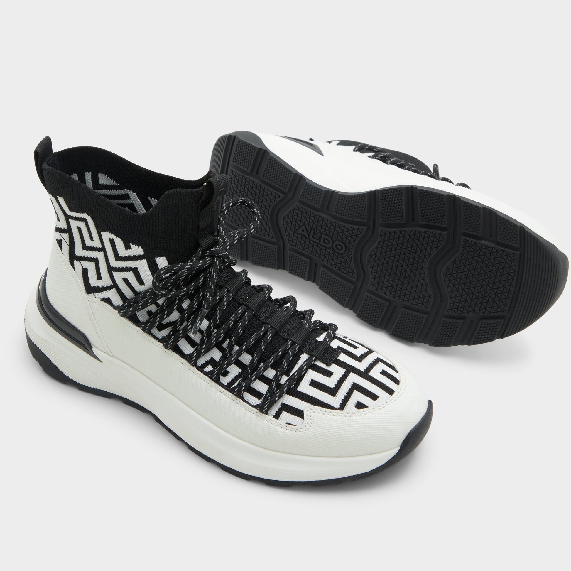 Highlighted view of a pair of White/Black Everlynn Jogger sneakers
