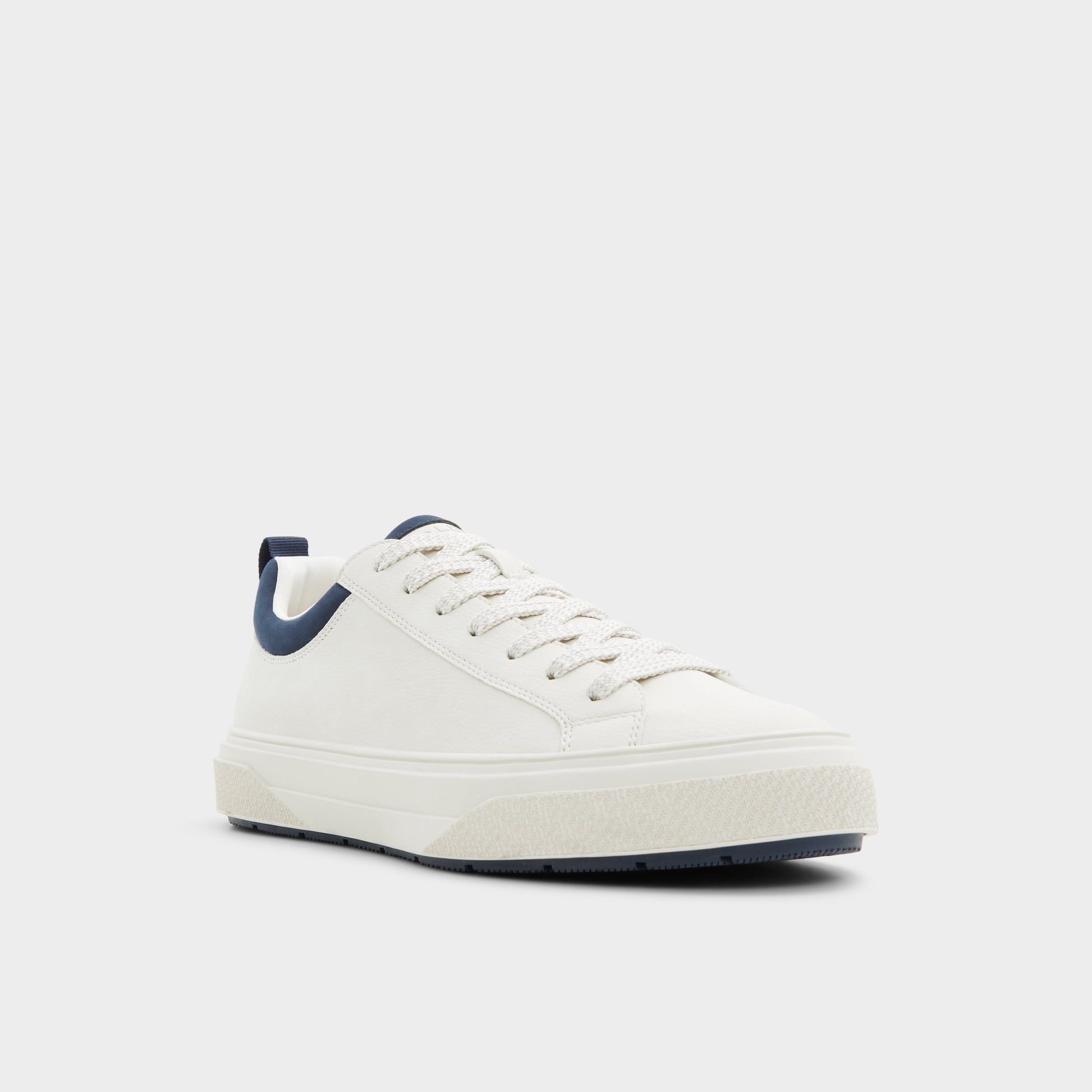 Three-quarter angle of White/Bone Bas Low top sneaker's front side