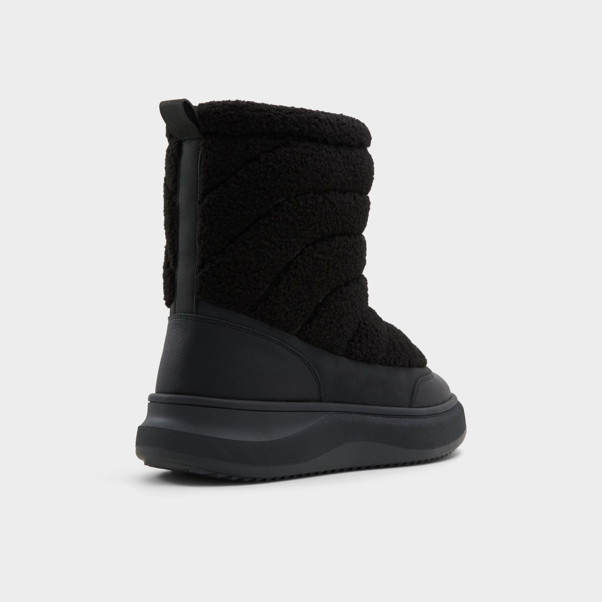 Three-quarter angle of Black Fucino Chelsea boot's back side
