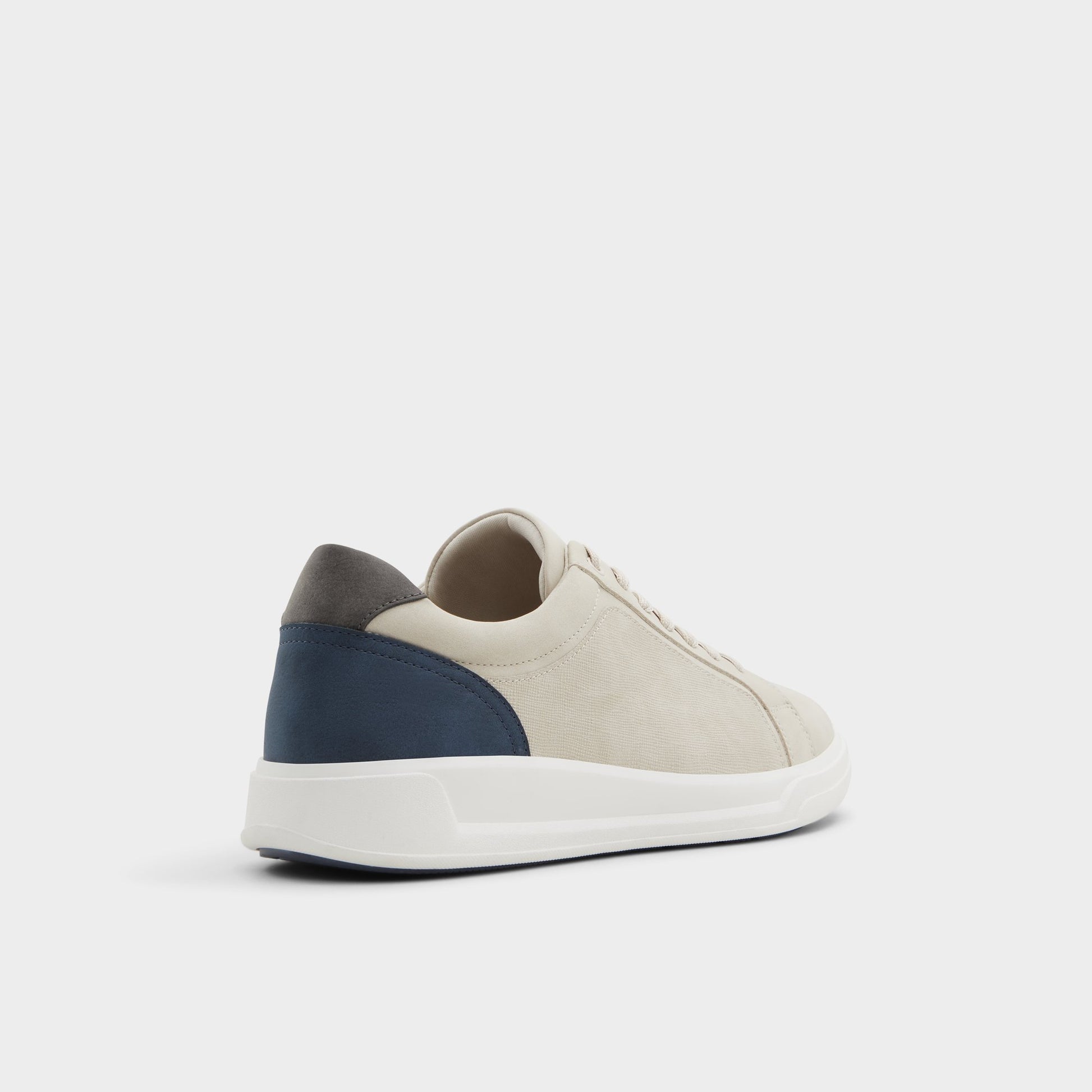 Three-quarter angle of Beige Ogspec Low top sneaker's back side