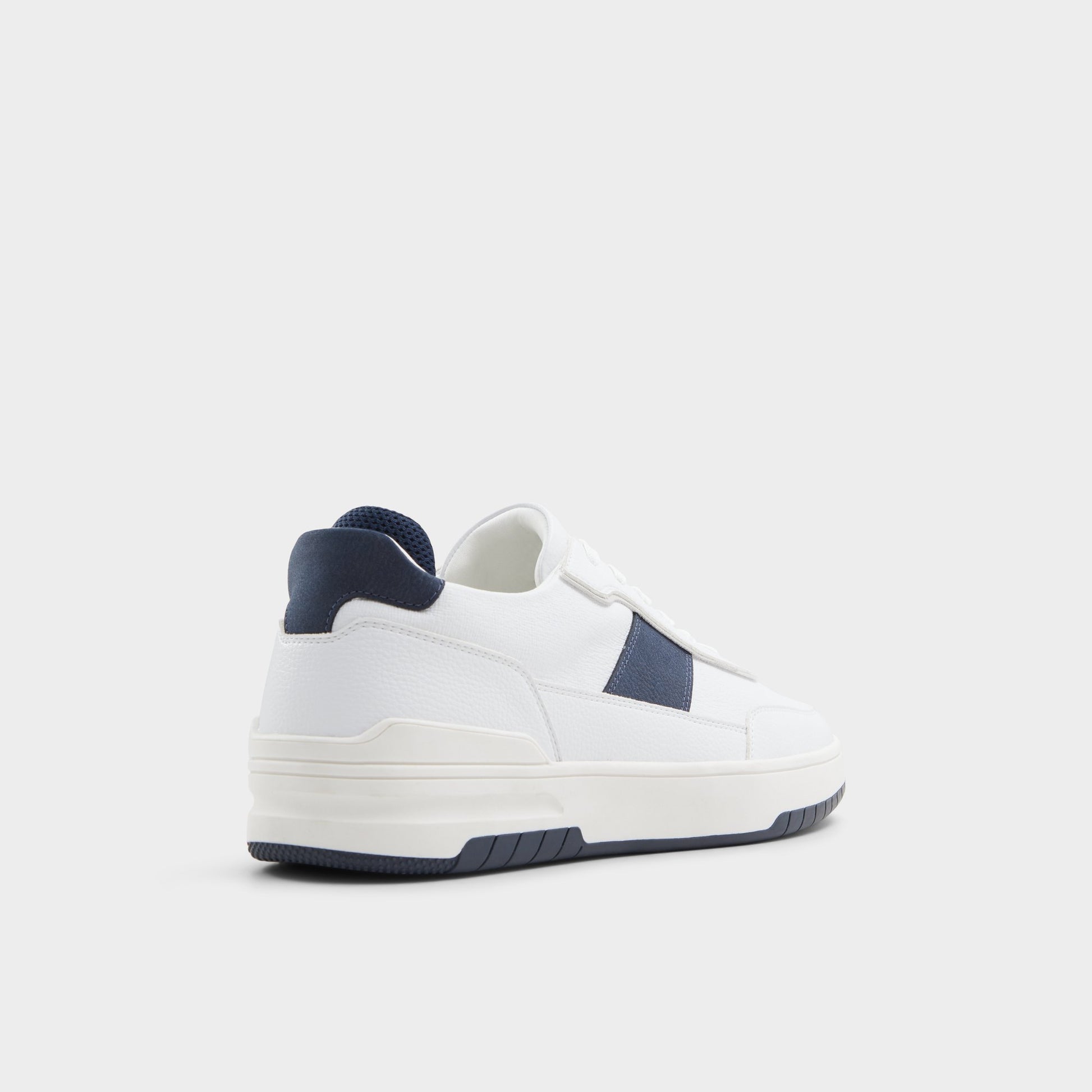 Three-quarter angle of White Creed Low top sneaker's back side
