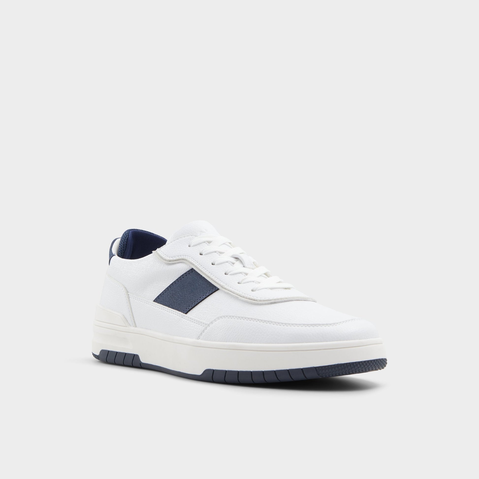 Three-quarter angle of White Creed Low top sneaker's front side