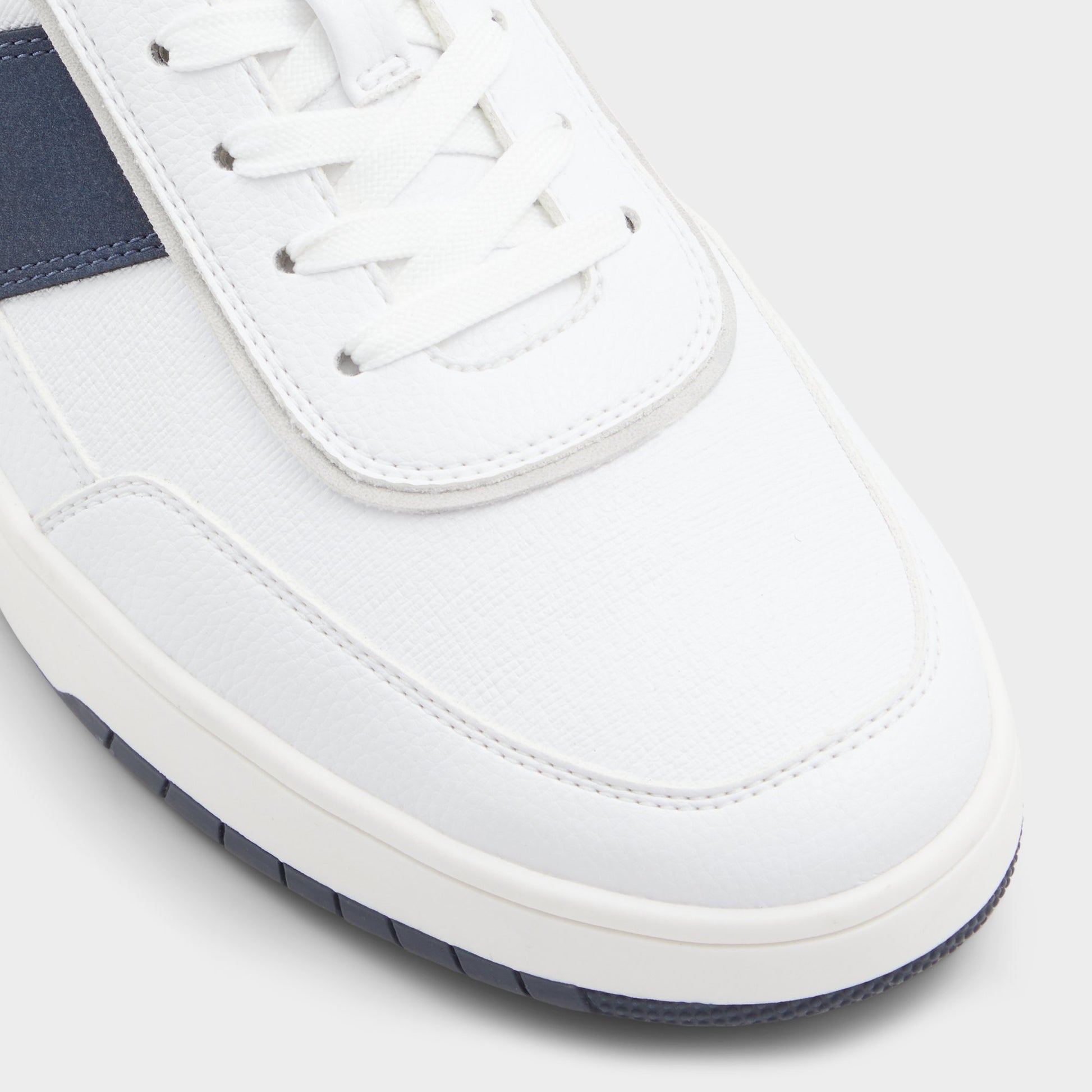 Close-up of the White Creed Low top sneaker