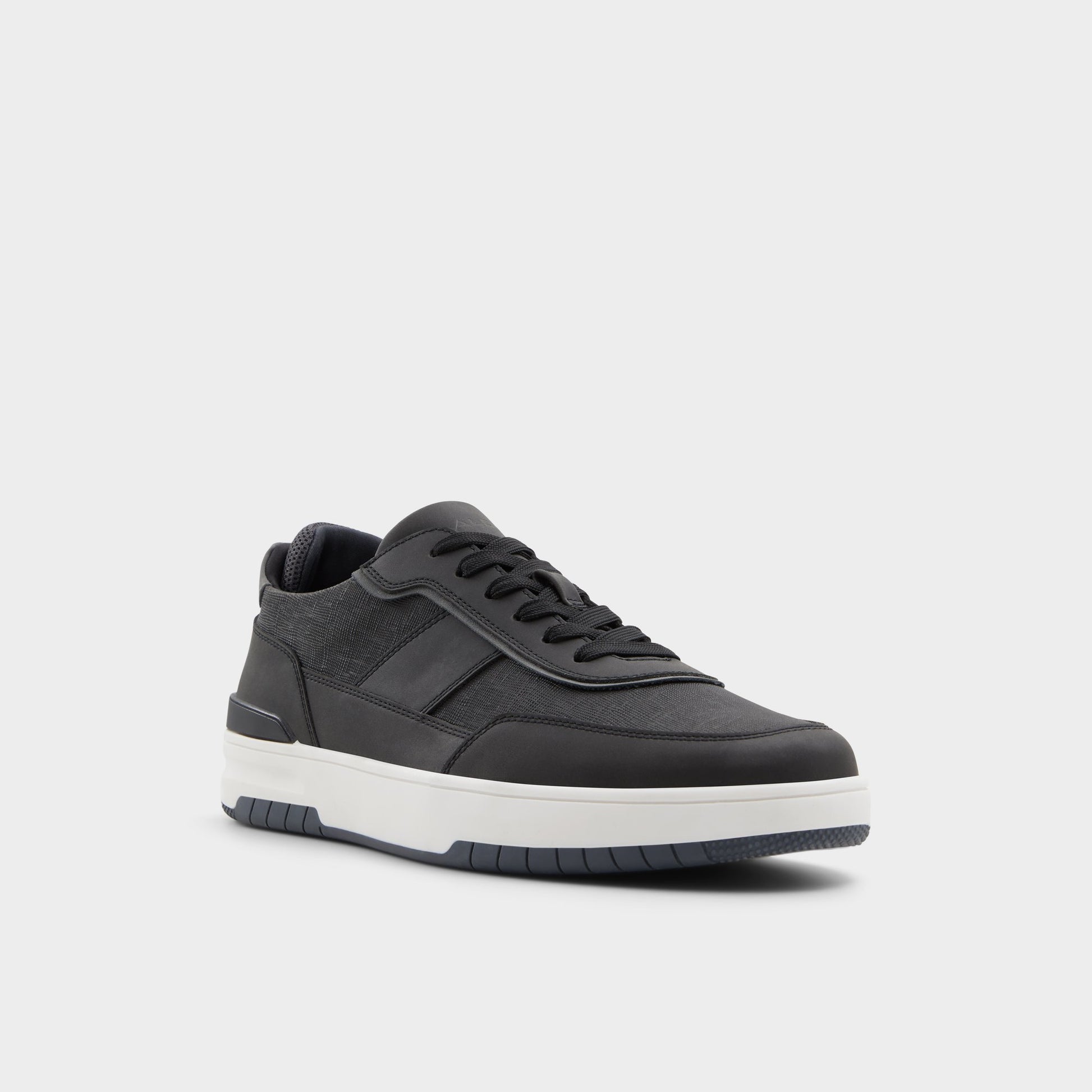 Three-quarter angle of Black Creed Low top sneaker's front side