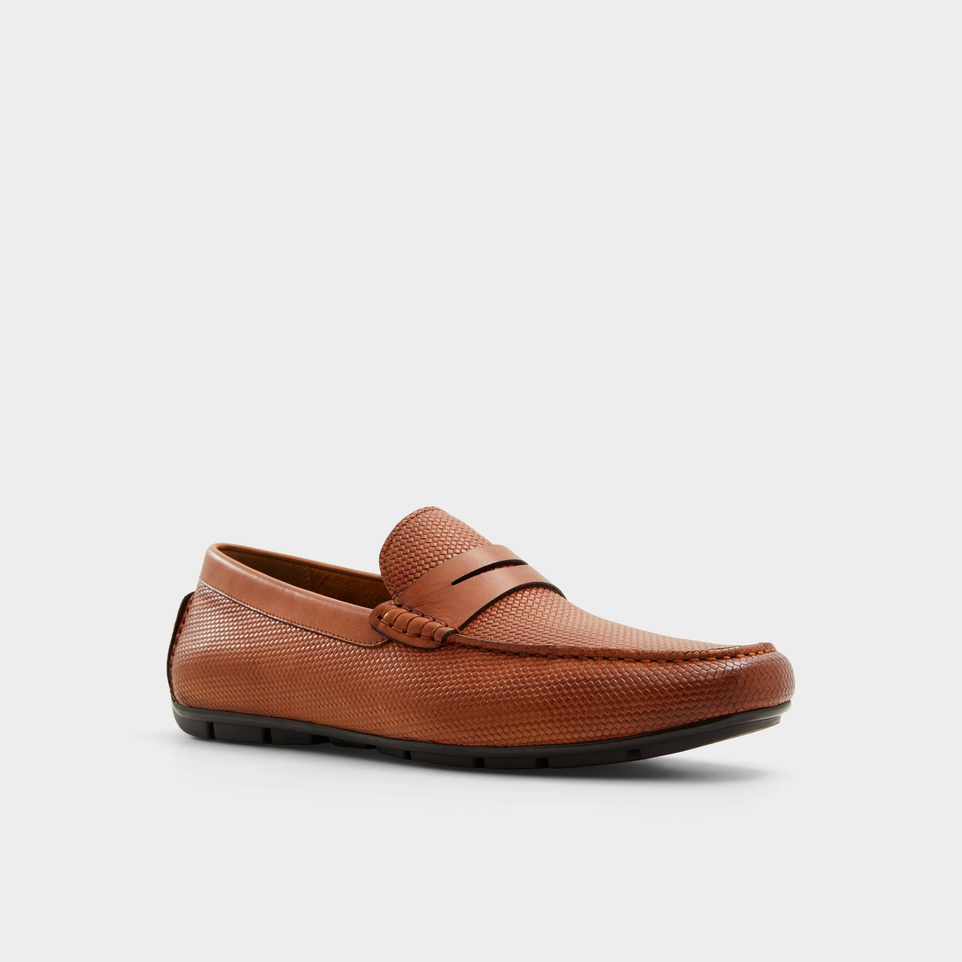 Three-quarter angle of Other Brown Discourse Driving shoe's front side