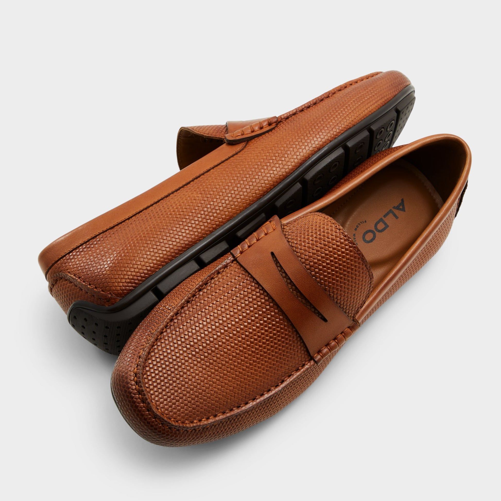 Highlighted view of a pair of Other Brown Discourse Driving shoes
