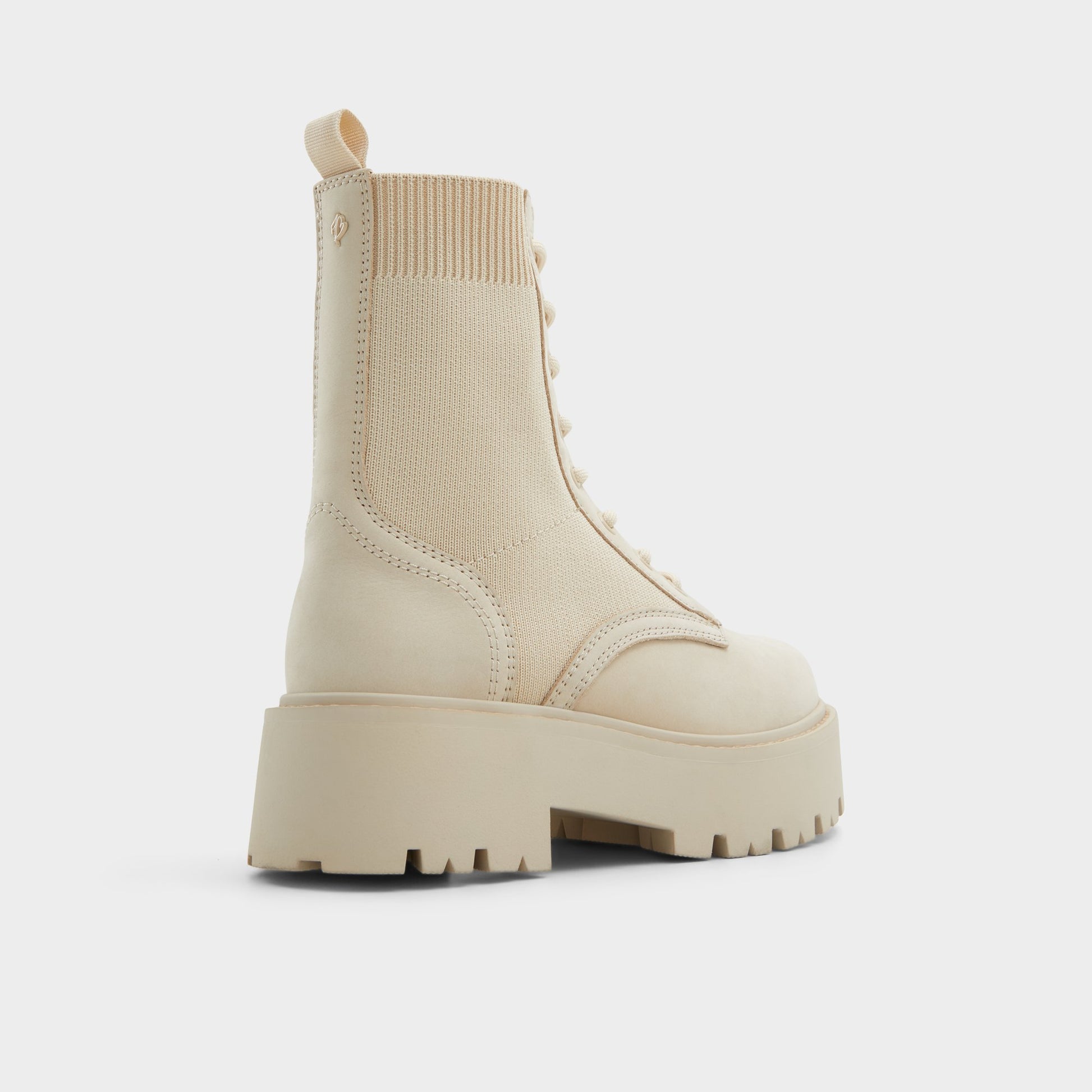 Three-quarter angle of Beige Talaleryknit Combat ankle boot's back side