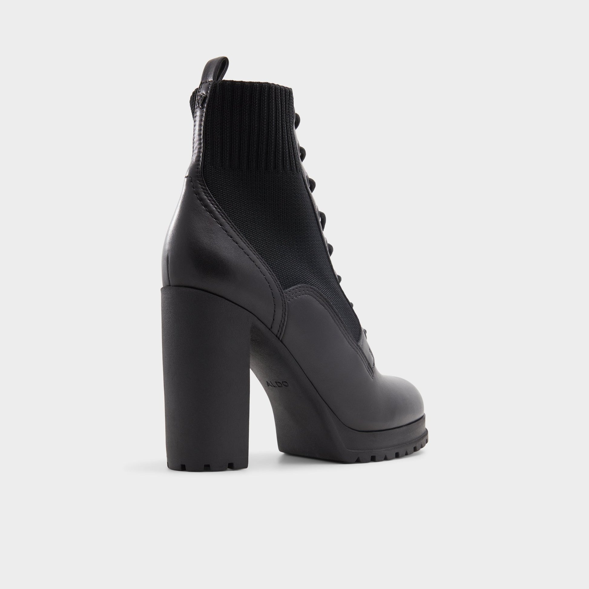 Three-quarter angle of Black Rebellious Combat ankle boot's back side