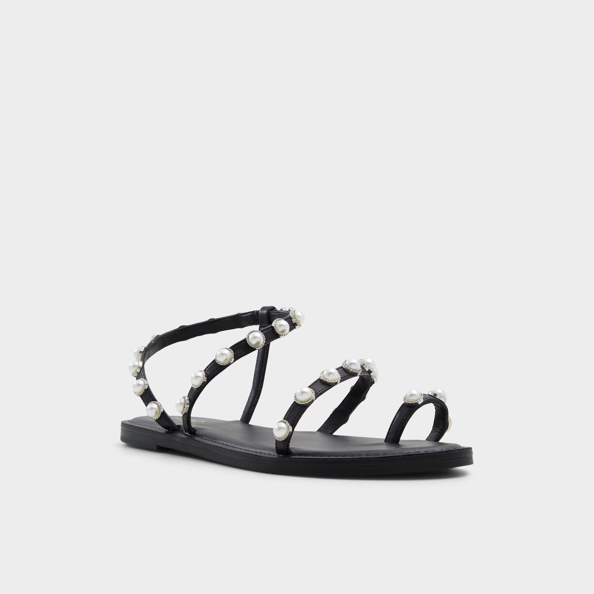Three-quarter angle of Black Coreydale Strappy flat sandal's front side