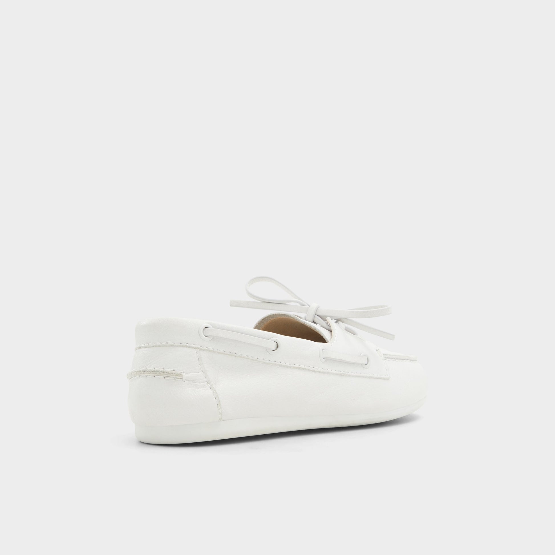 Three-quarter angle of White/Bone Sail Boat shoe's back side