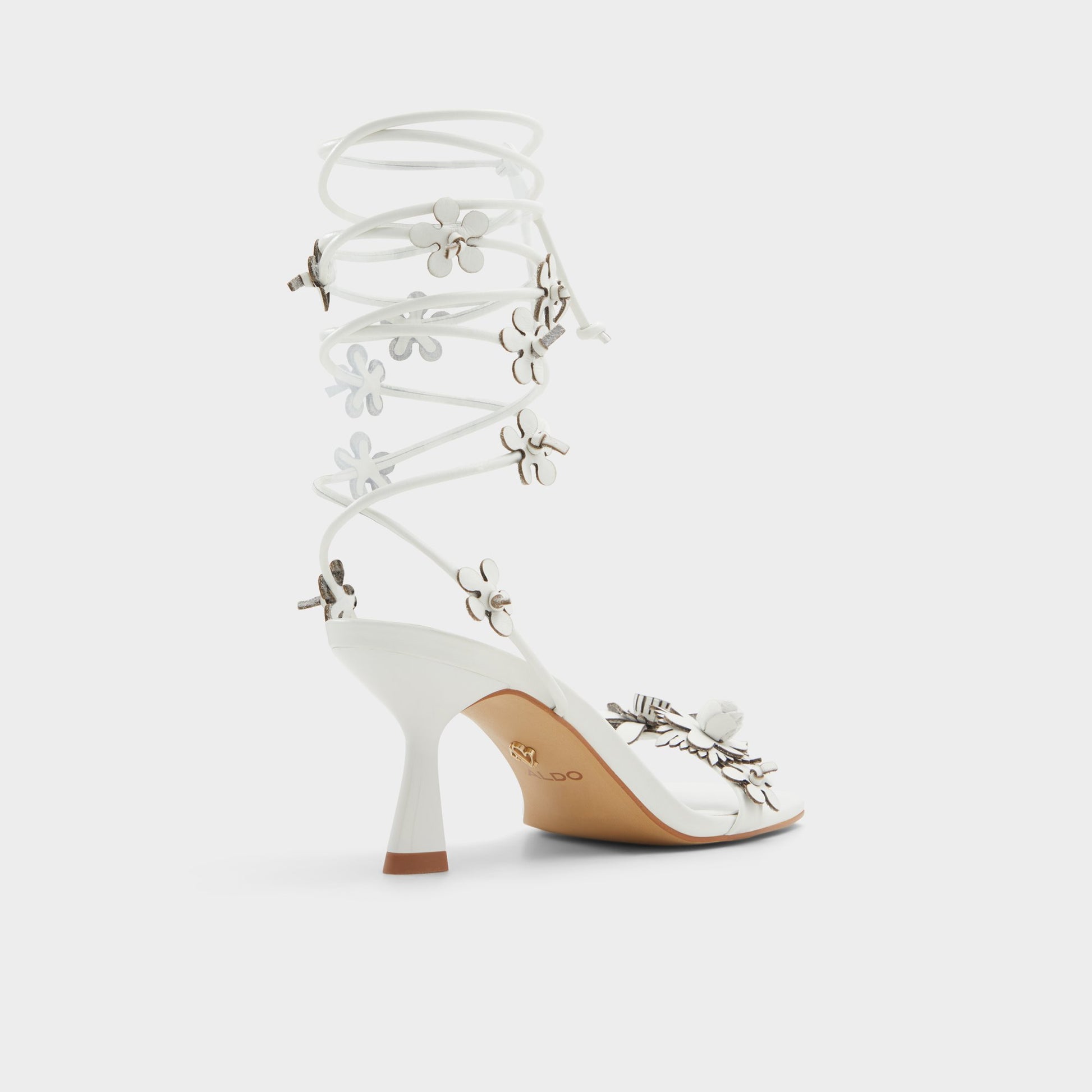 Three-quarter angle of White/Bone Fiorela Strappy heeled sandal's back side