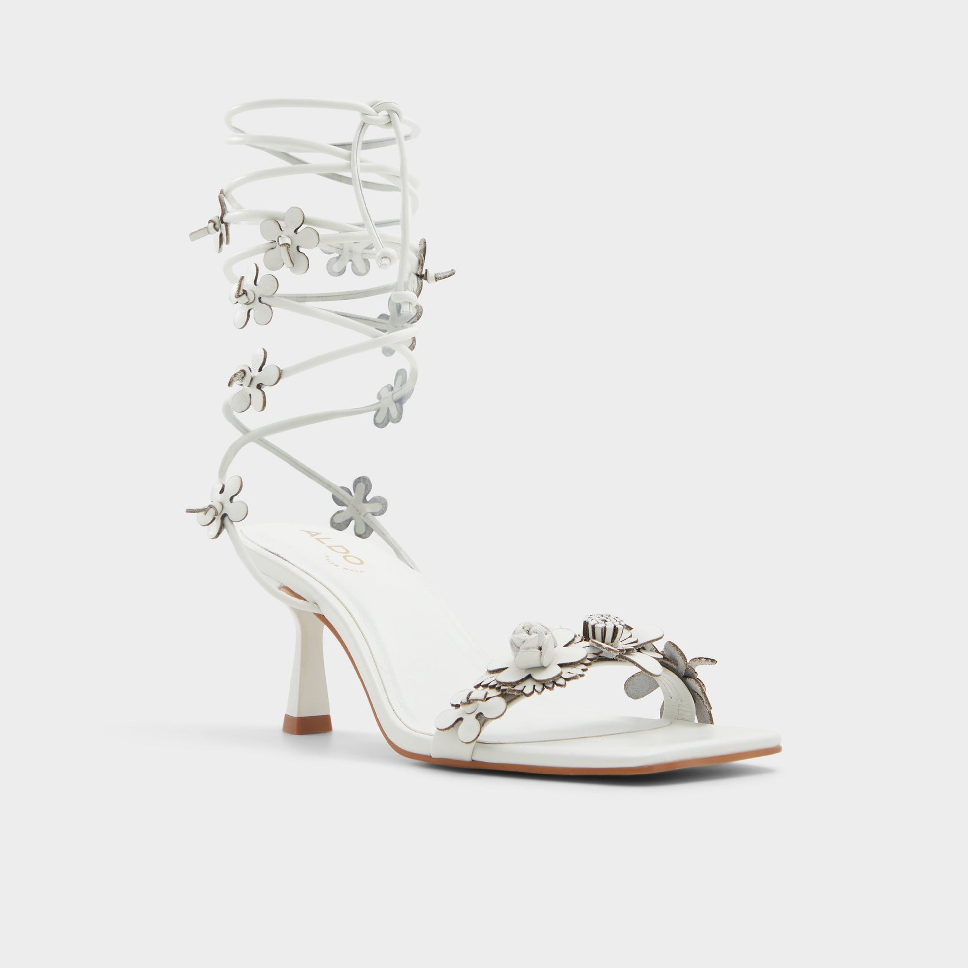Three-quarter angle of White/Bone Fiorela Strappy heeled sandal's front side