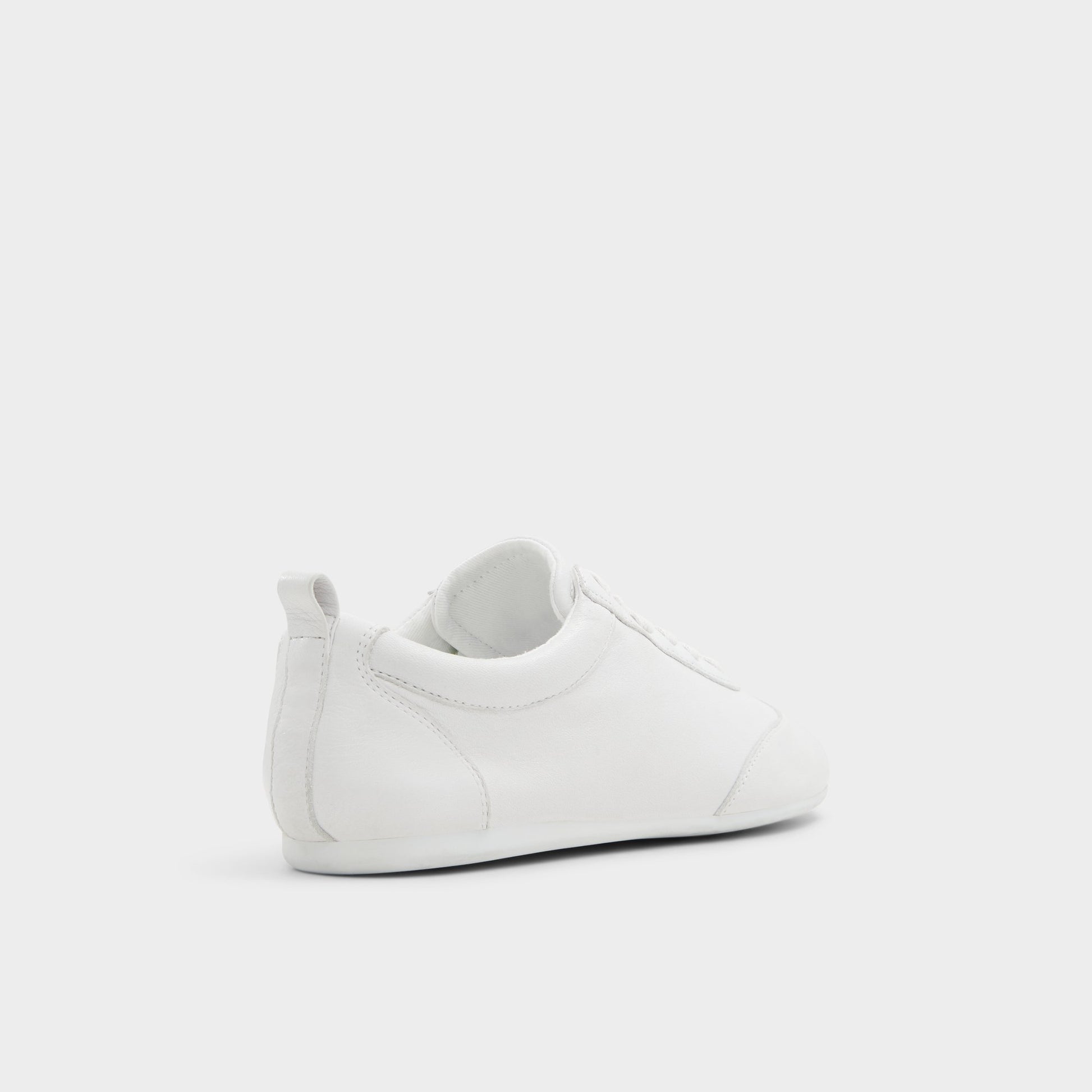 Three-quarter angle of White/Bone Swiftlyy Low top sneaker's back side