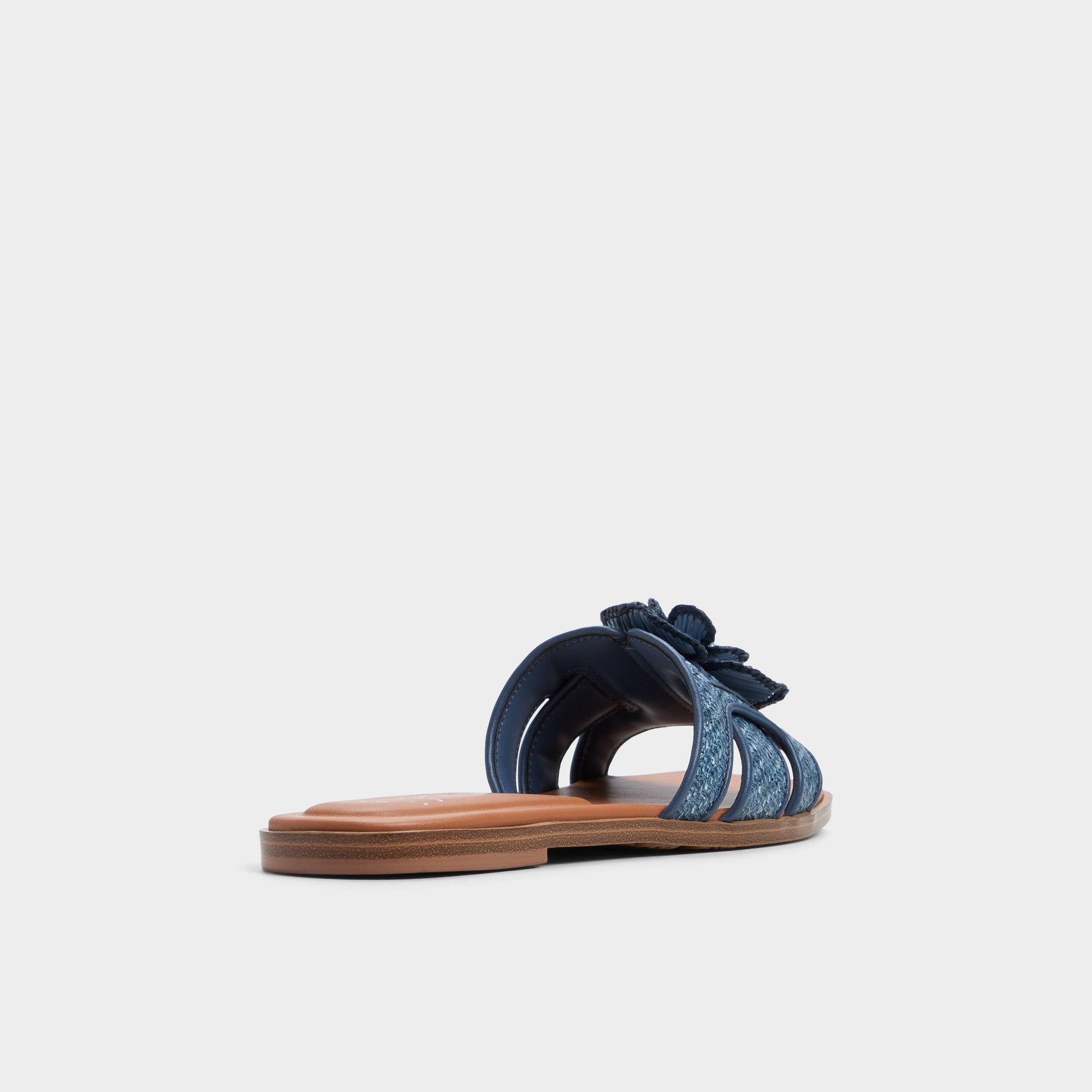 Three-quarter angle of Denim Seaflower Slide sandal's back side