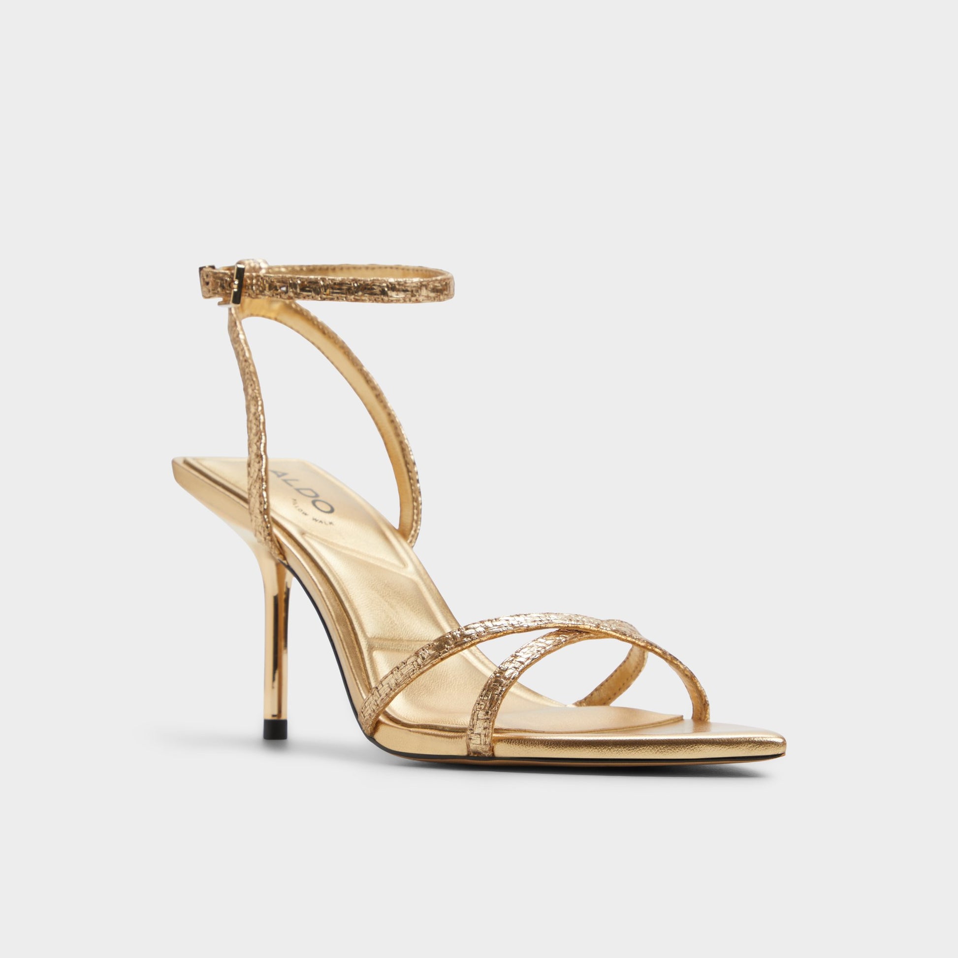 Three-quarter angle of Gold Adrina Strappy heeled sandal's front side
