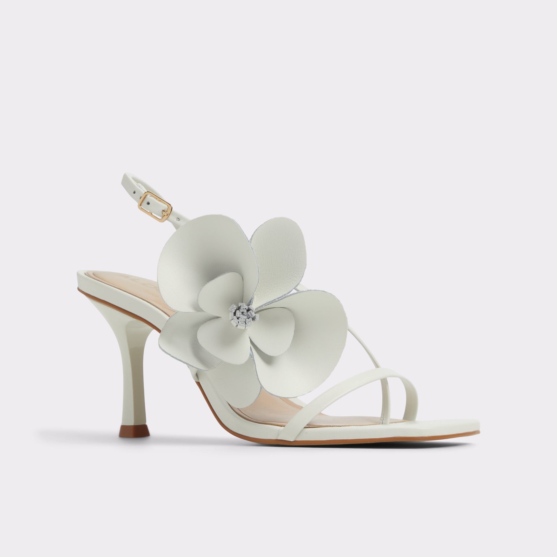 Three-quarter angle of White/Bone Sandflower Strappy heeled sandal's front side