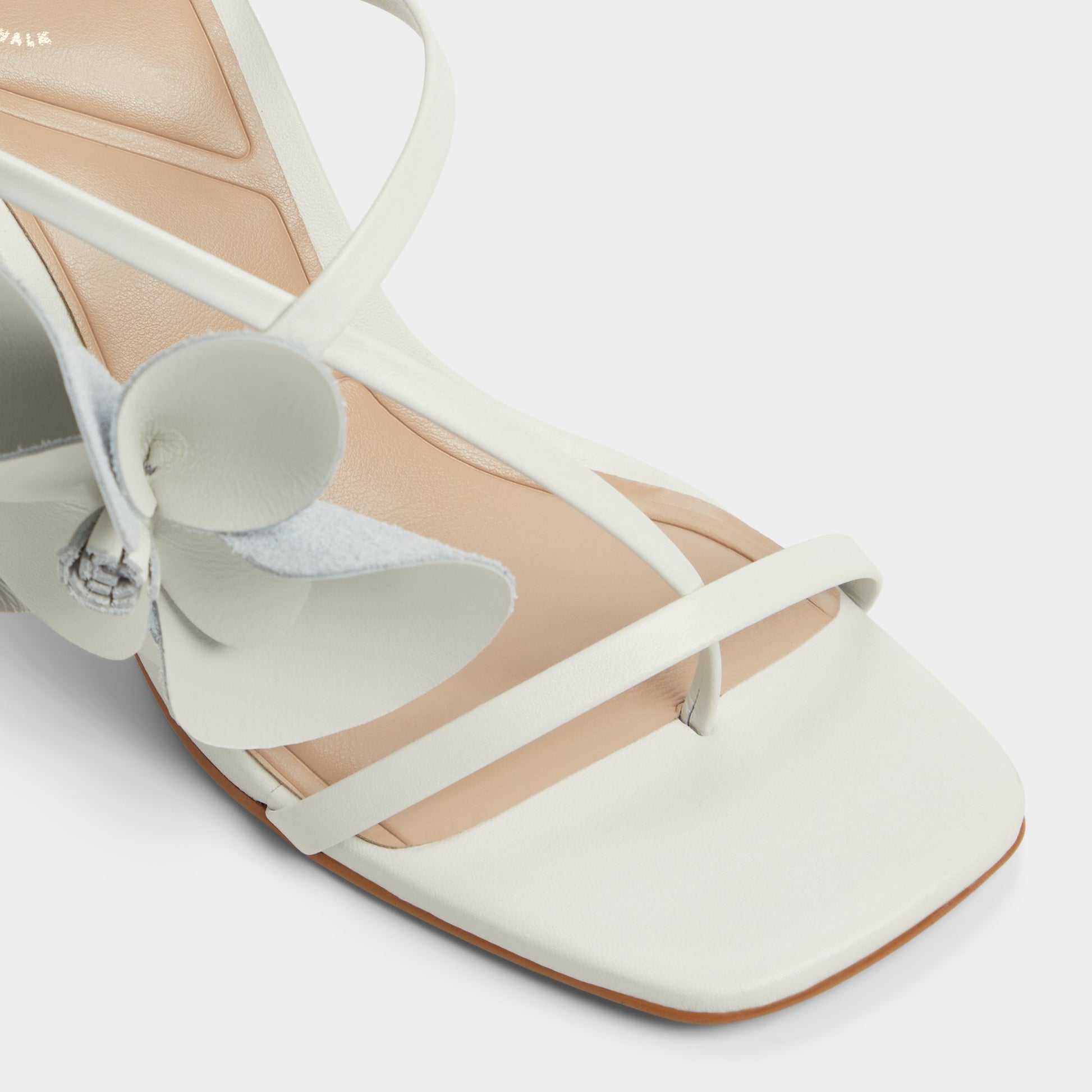 Close-up of the White/Bone Sandflower Strappy heeled sandal