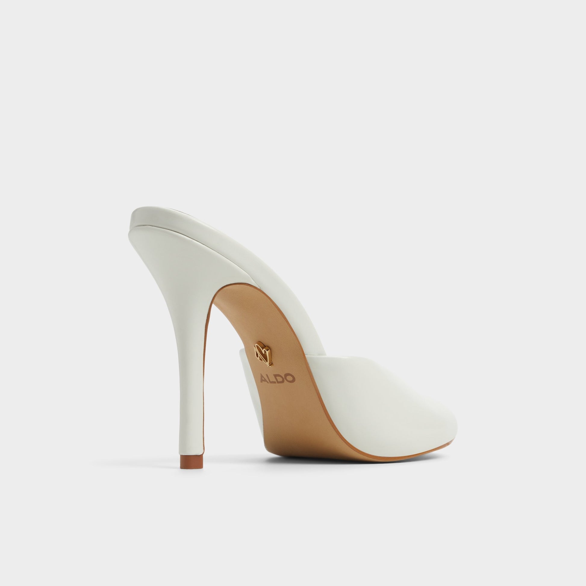 Three-quarter angle of White/Bone Fidelia Heeled mule's back side