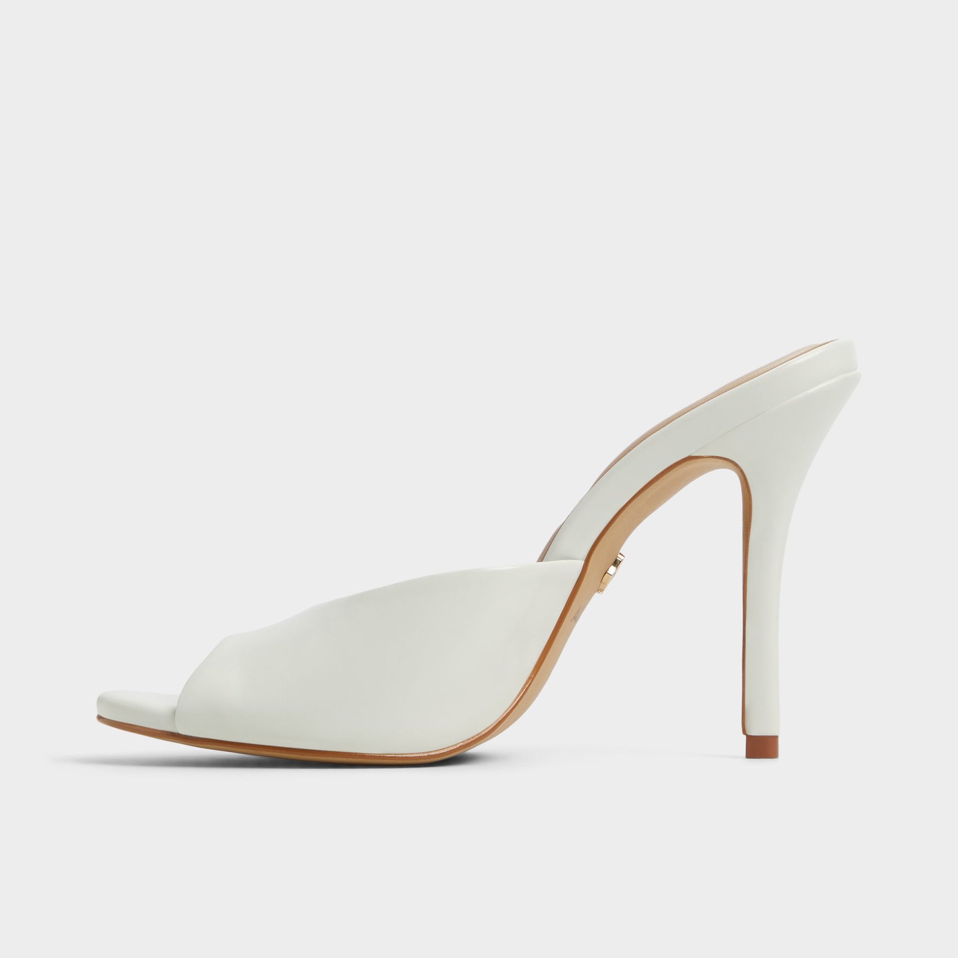 Side view of White/Bone Fidelia Heeled mule
