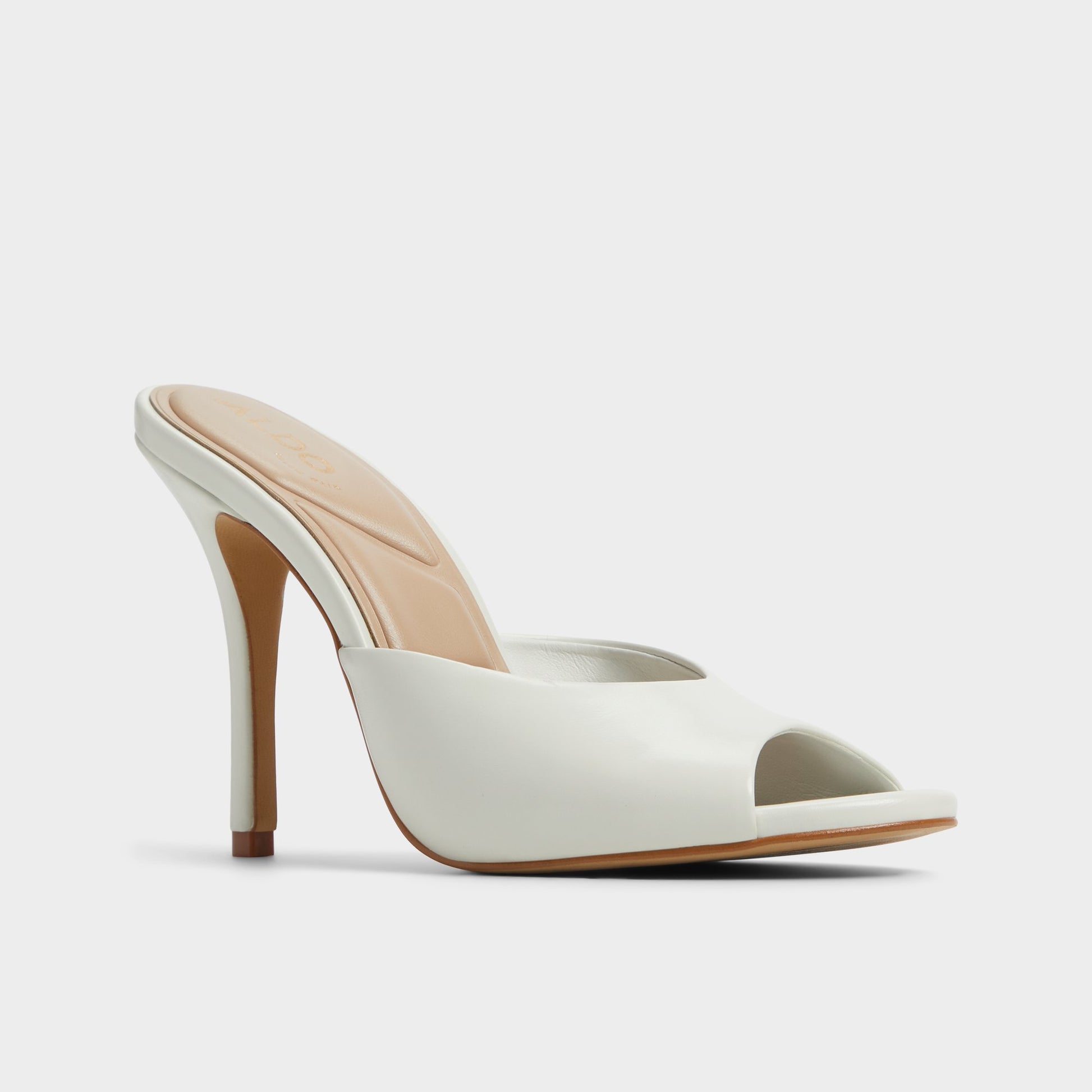 Three-quarter angle of White/Bone Fidelia Heeled mule's front side