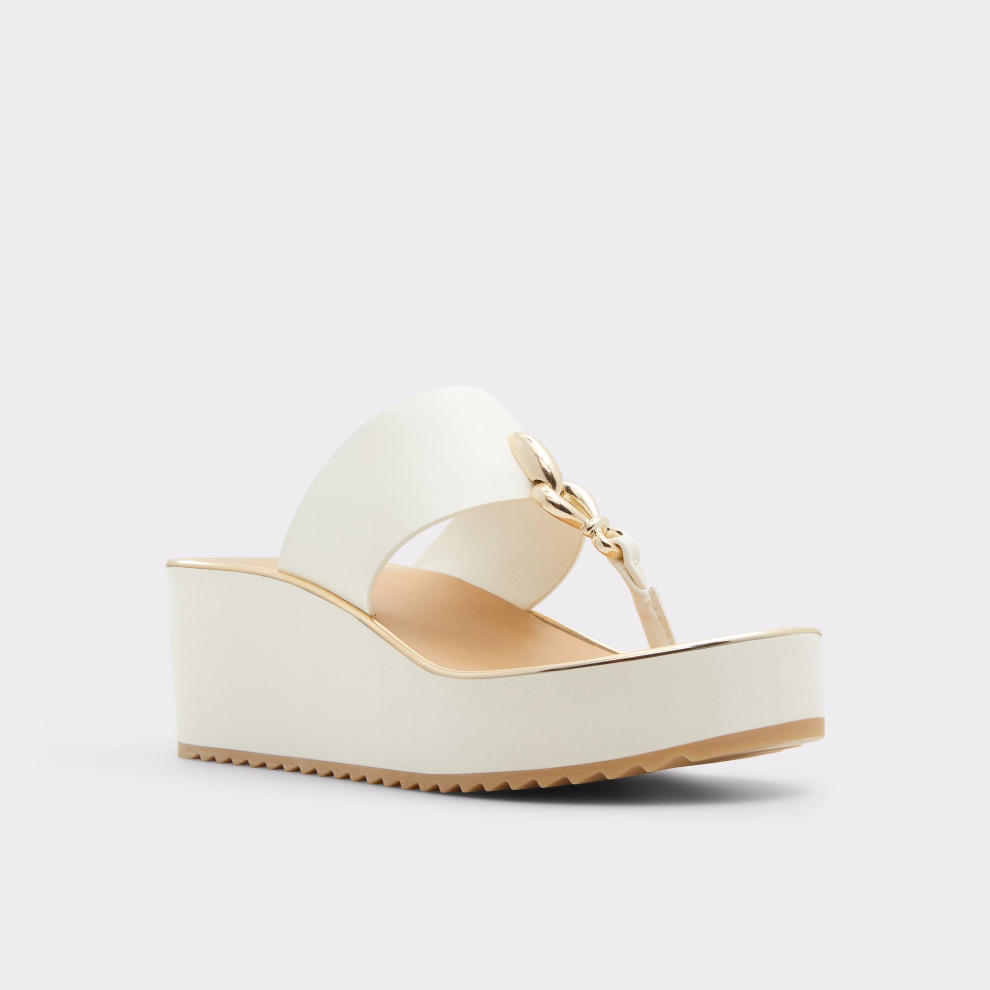 Three-quarter angle of White Penelopy Wedge sandal's front side