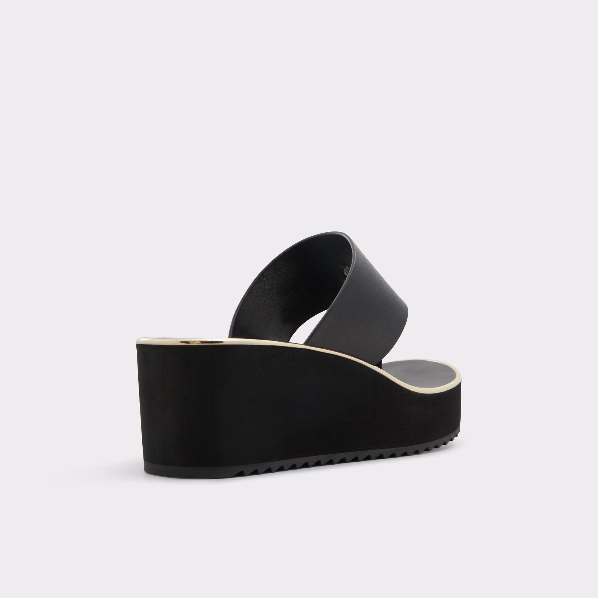 Three-quarter angle of Black Penelopy T-strap sandal's back side