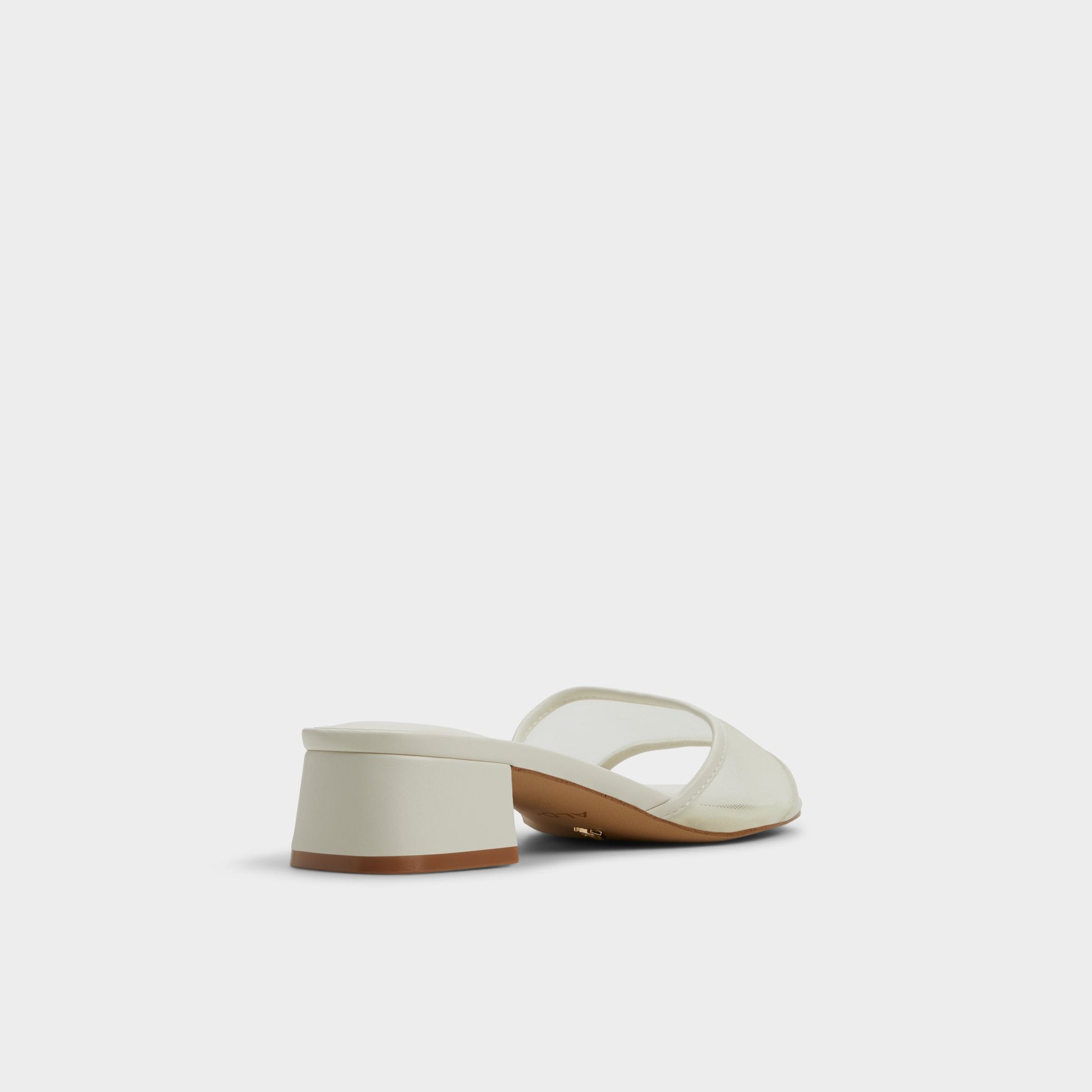 Three-quarter angle of White Rosamund Heeled mule's back side