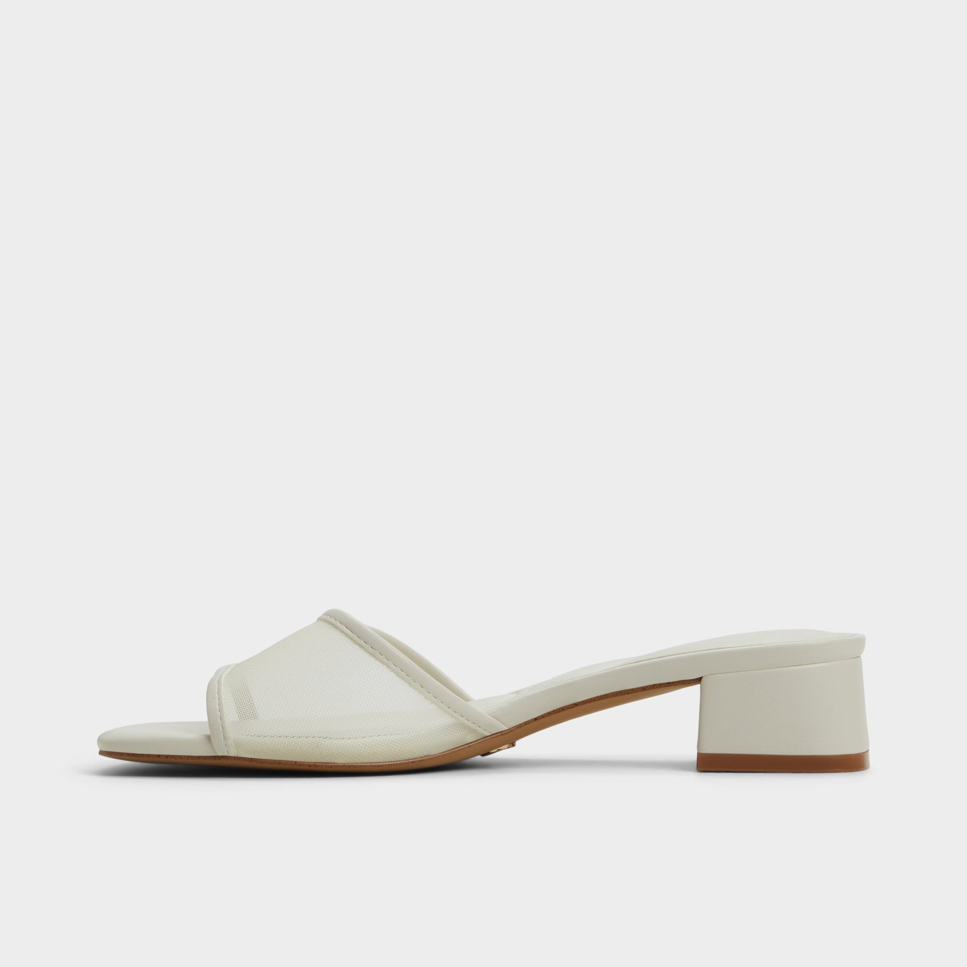 Side view of White Rosamund Heeled mule