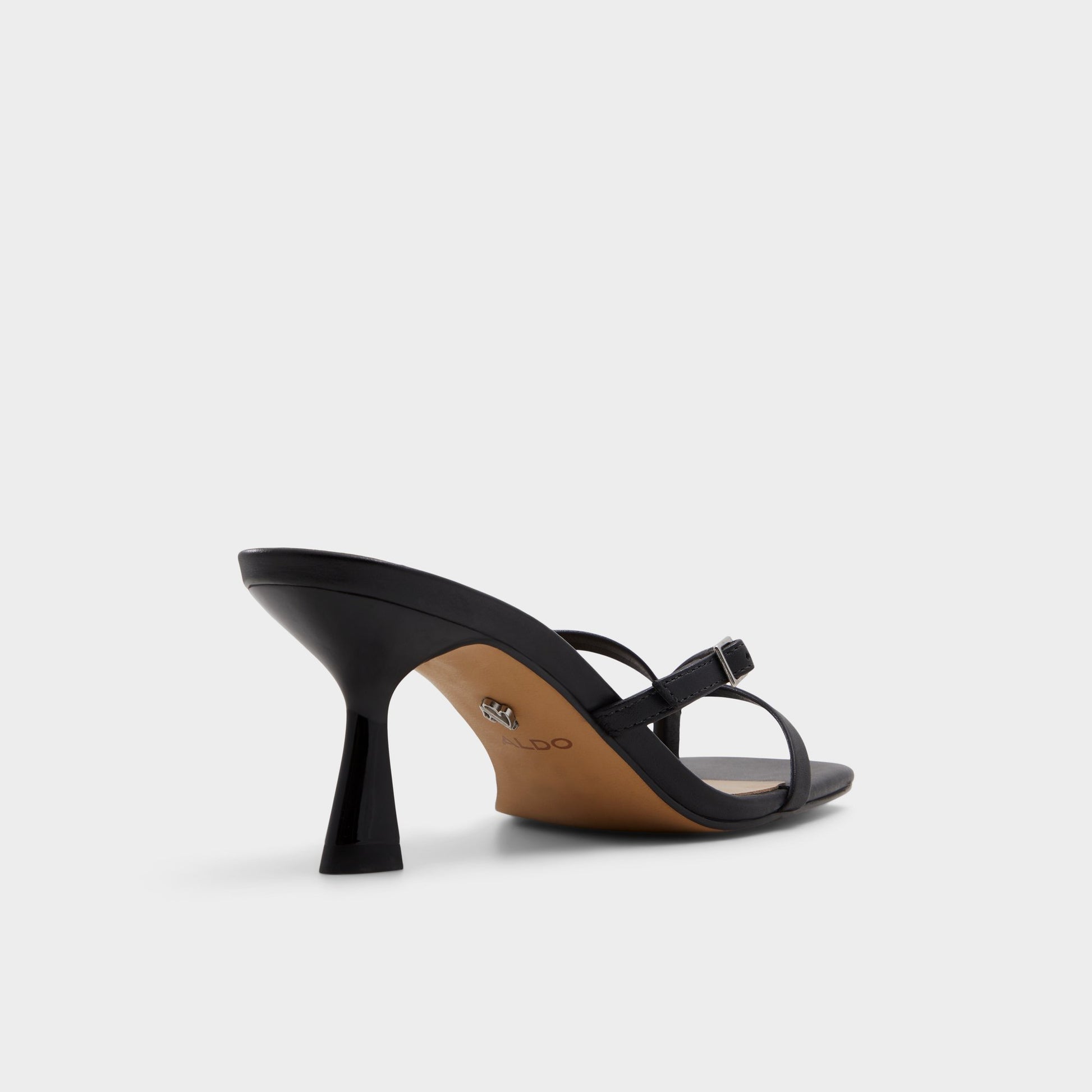 Three-quarter angle of Black Gannever Heeled flip flop's back side