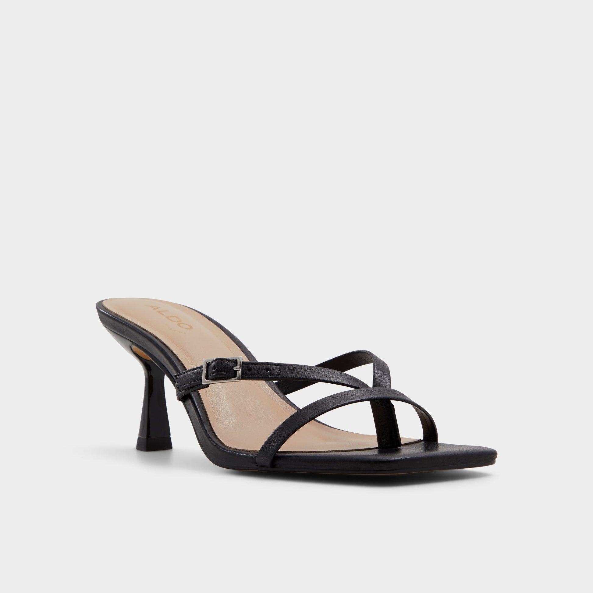 Three-quarter angle of Black Gannever Heeled flip flop's front side