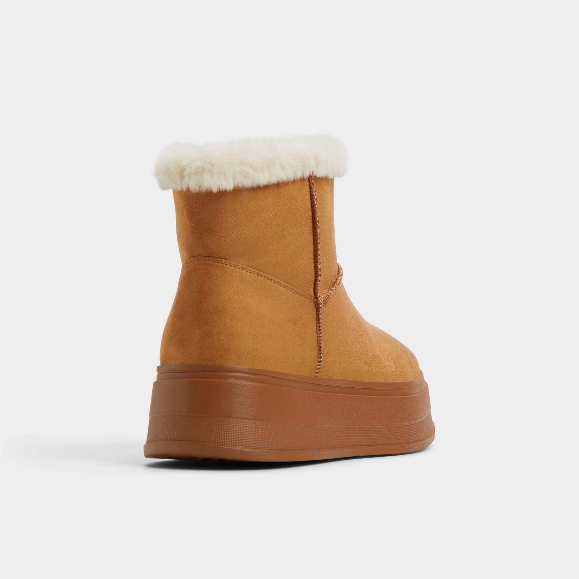 Three-quarter angle of Tan Plushy Ankle boot's back side