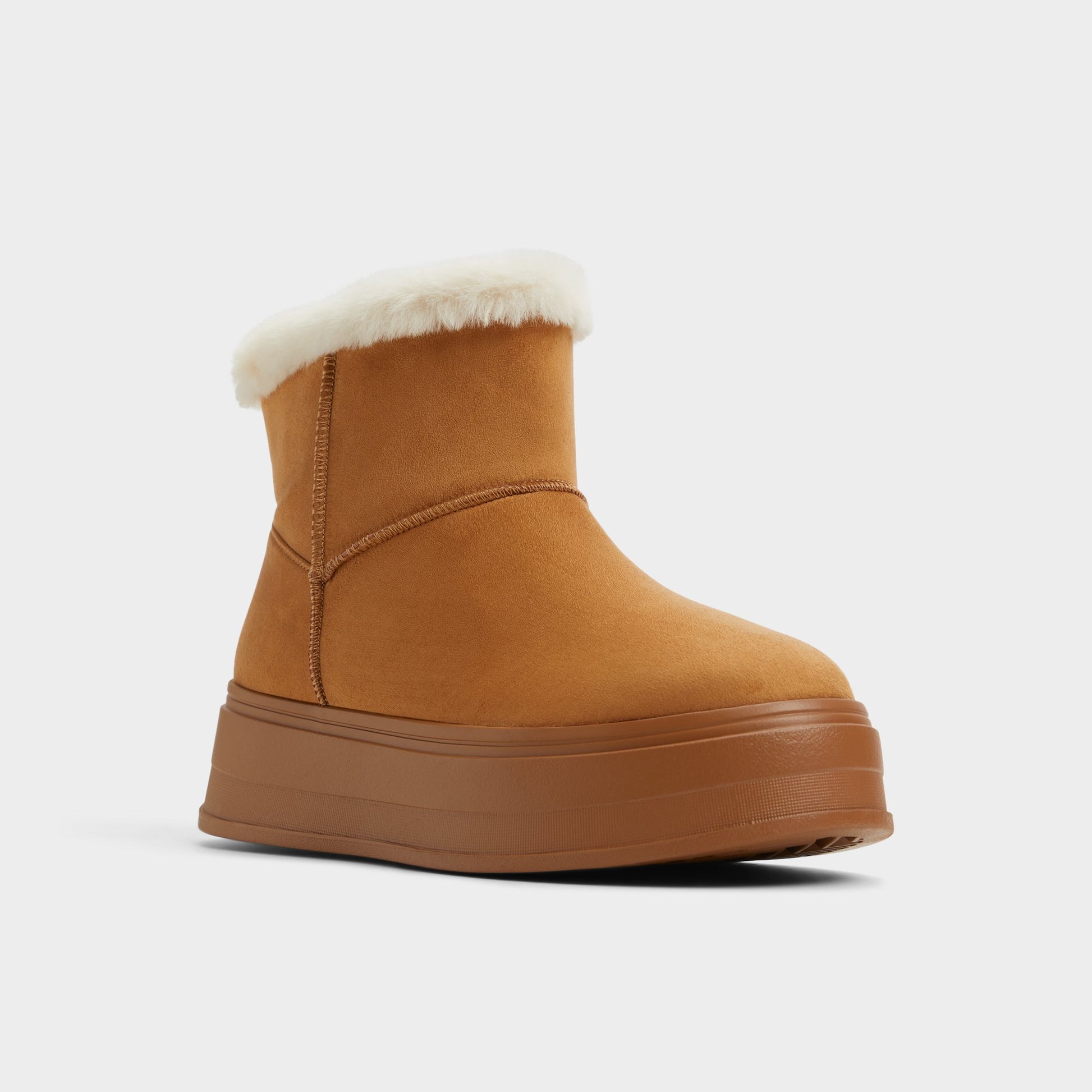 Three-quarter angle of Tan Plushy Ankle boot's front side
