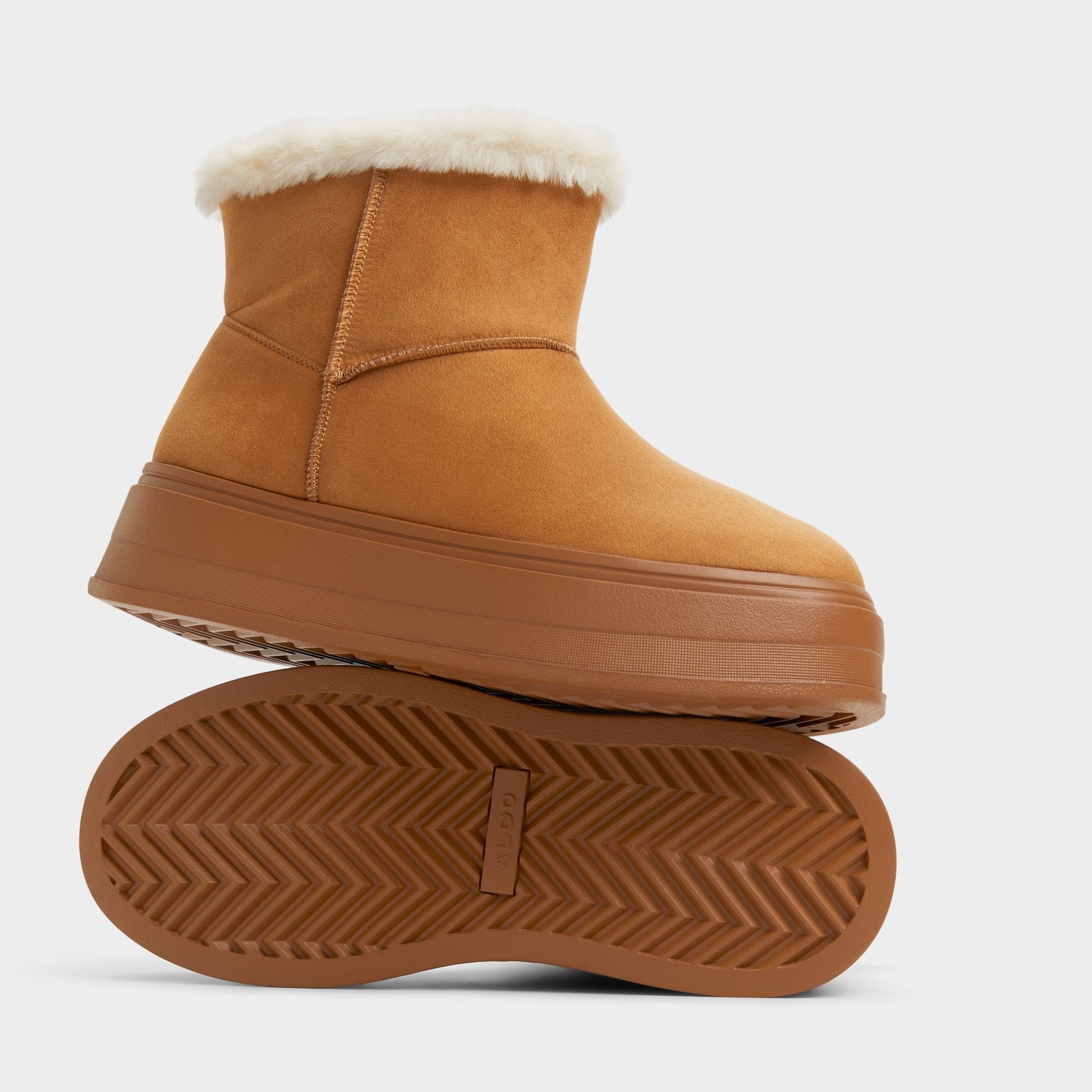Highlighted view of a pair of Tan Plushy Ankle boots