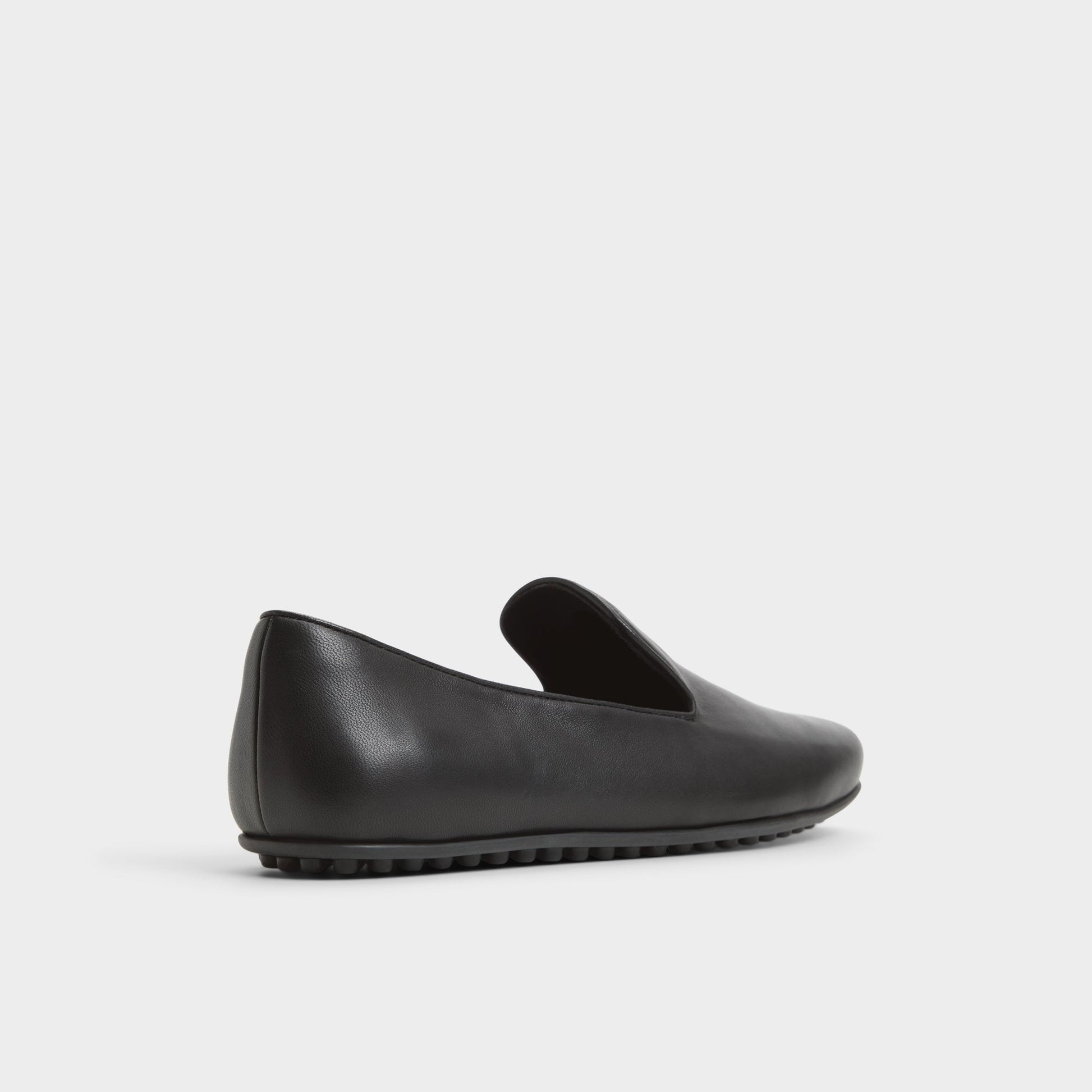 Three-quarter angle of Black Resolute Driving shoe's back side