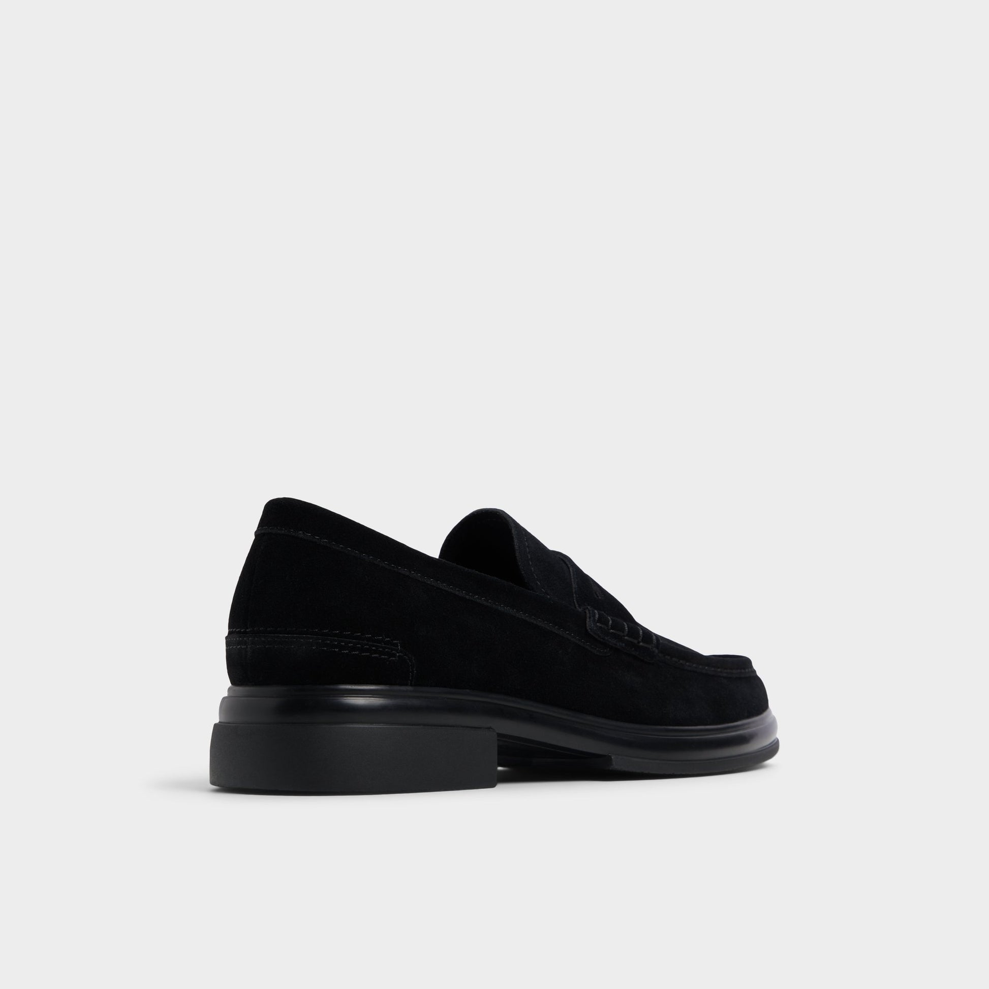 Three-quarter angle of Black/Black Tucker Loafer's back side