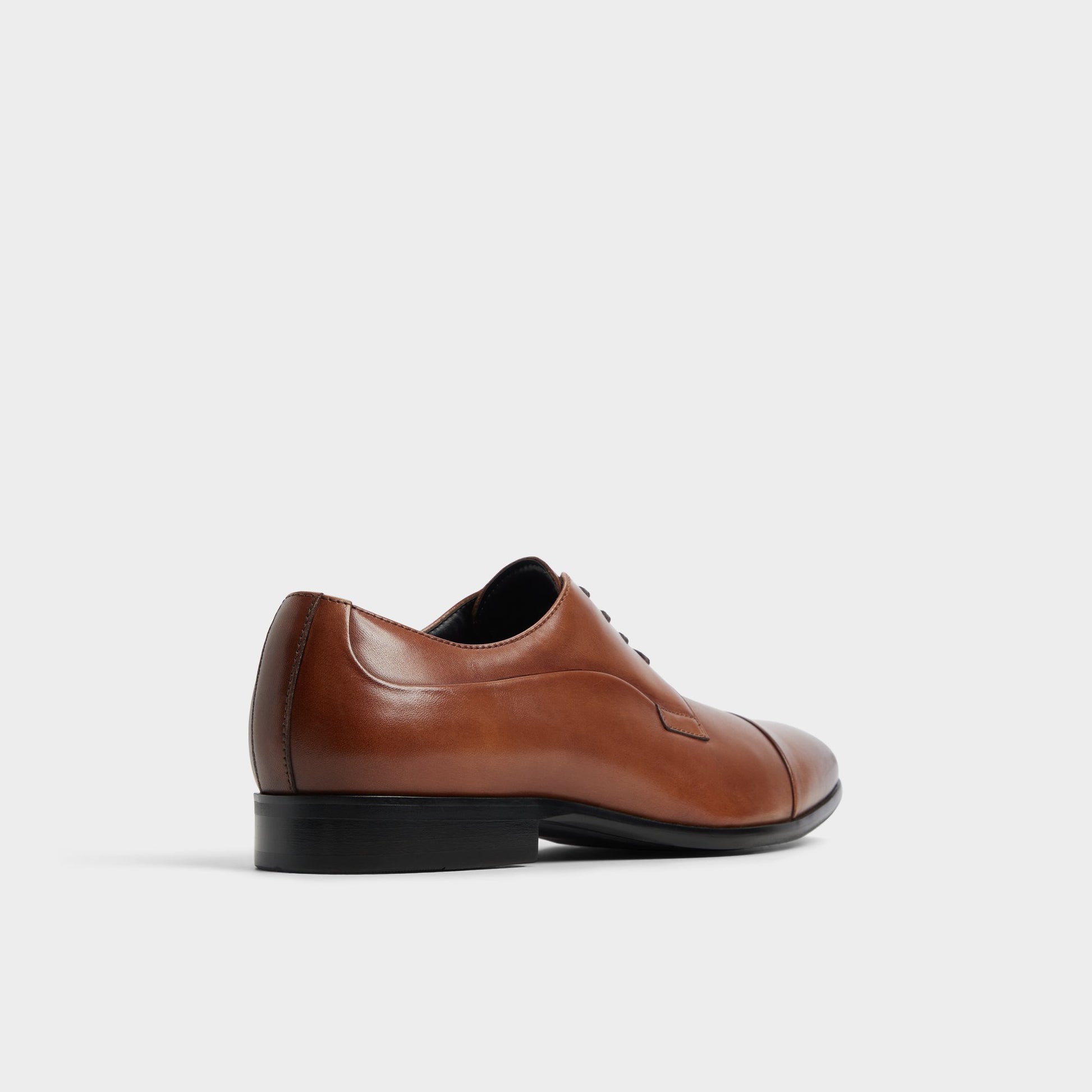 Three-quarter angle of Cognac Daniells Derby shoe's back side