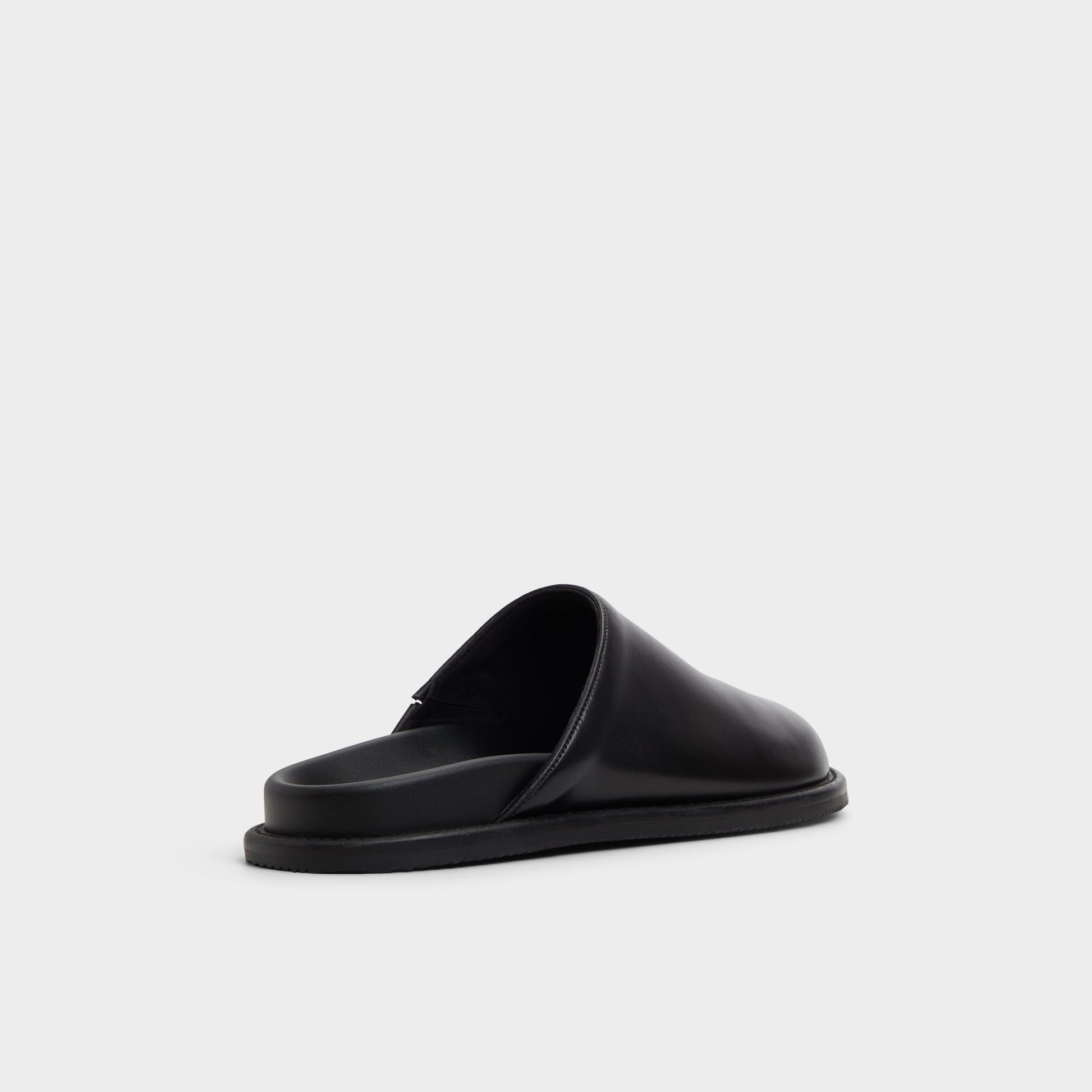 Three-quarter angle of Open Black Optimism Mule's back side