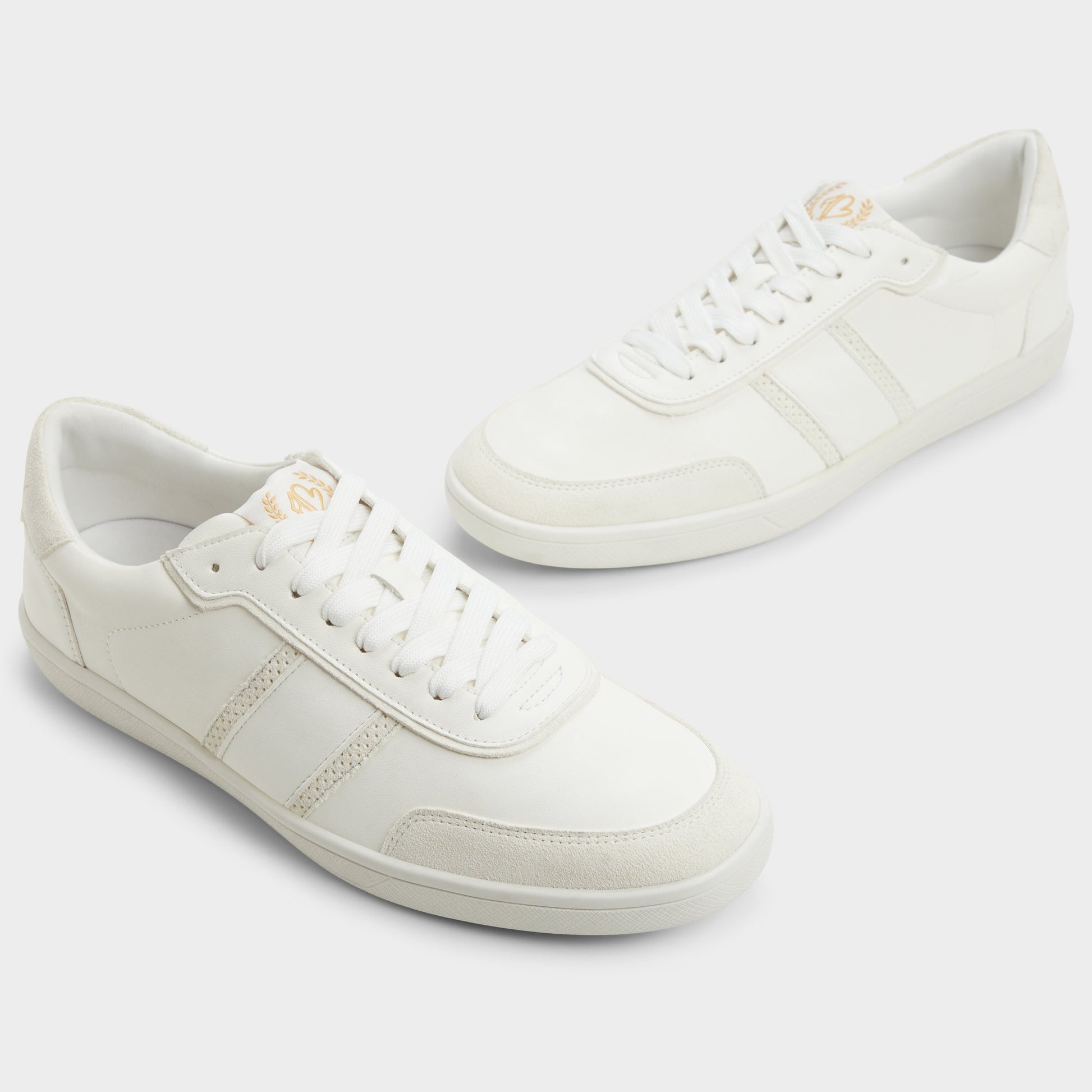 Highlighted view of a pair of Open White Uptown Low top sneakers