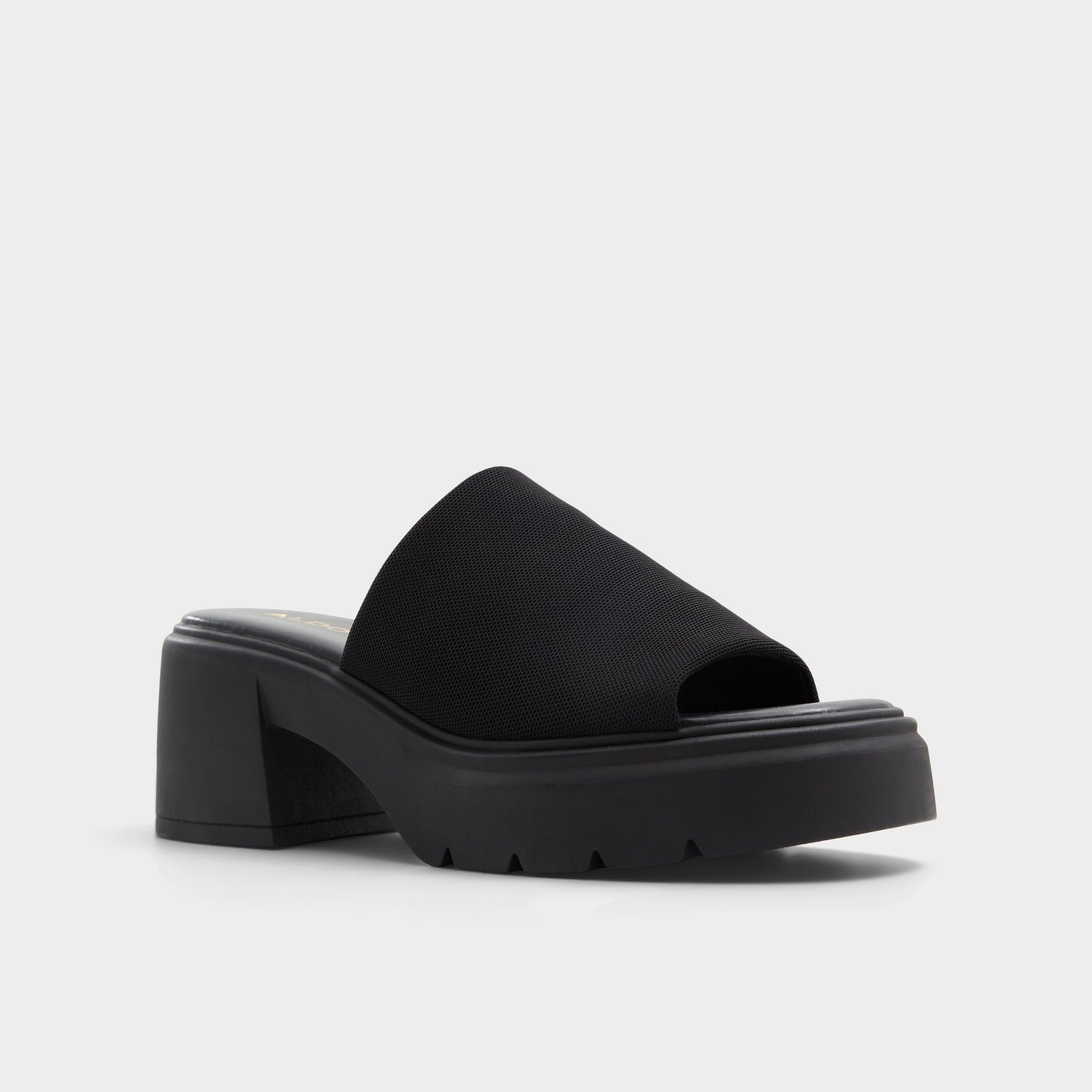 Three-quarter angle of Black Harrietta Heeled mule's front side