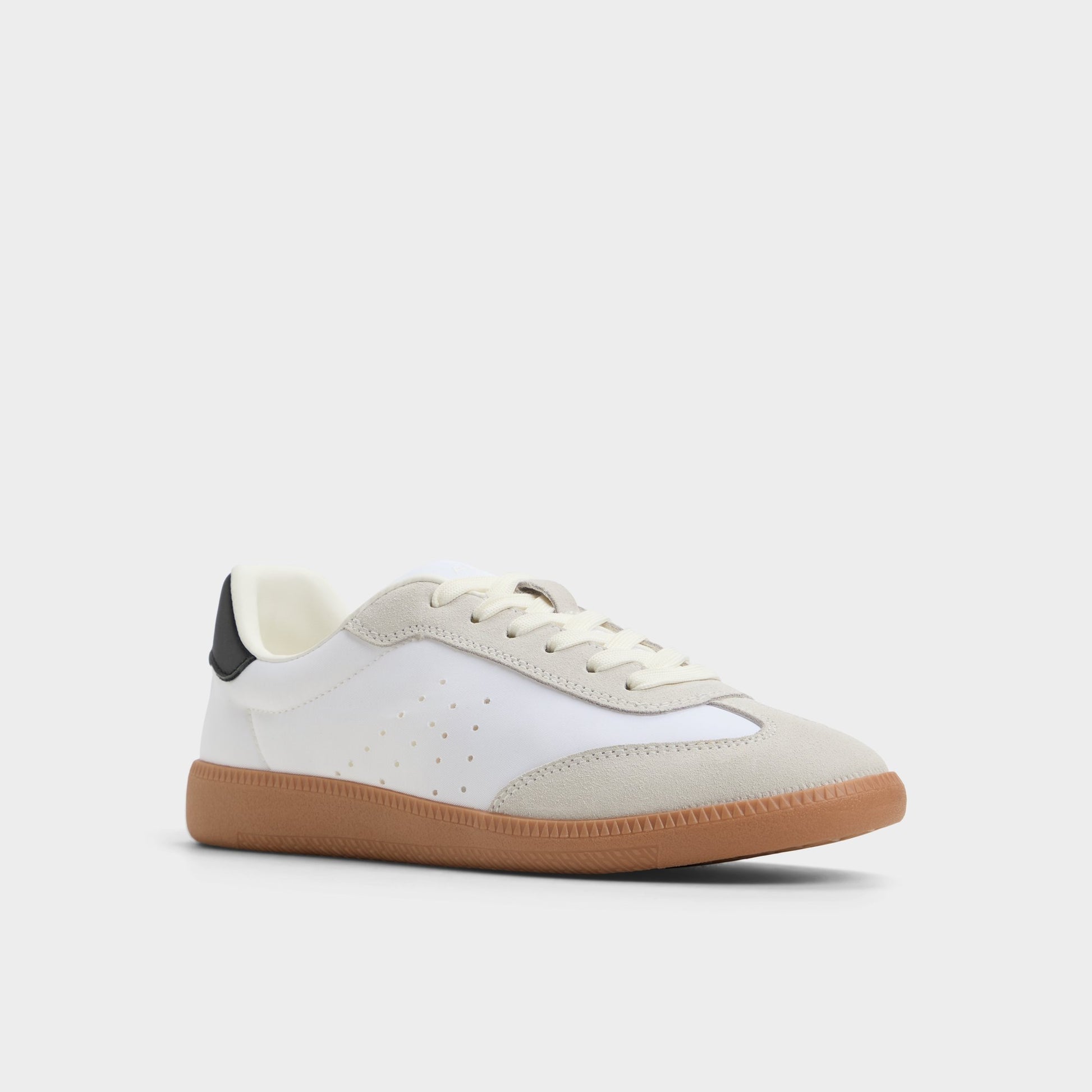 Three-quarter angle of White/Black Clubstyle Jogger sneaker's front side