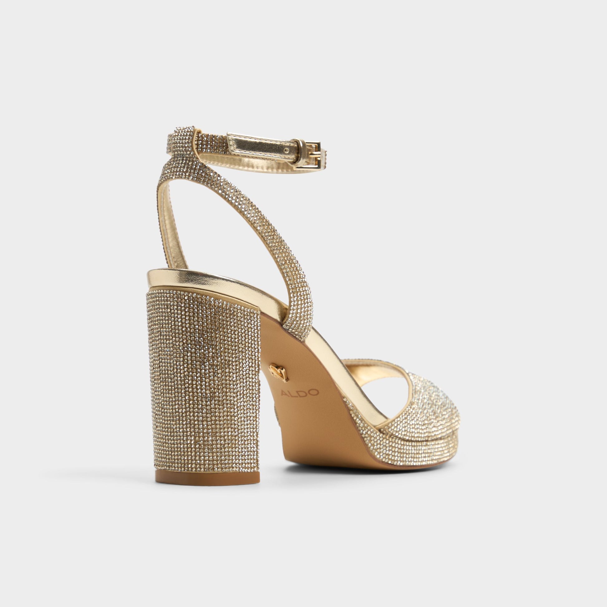 Three-quarter angle of Champagne Alluring Strappy heeled sandal's back side