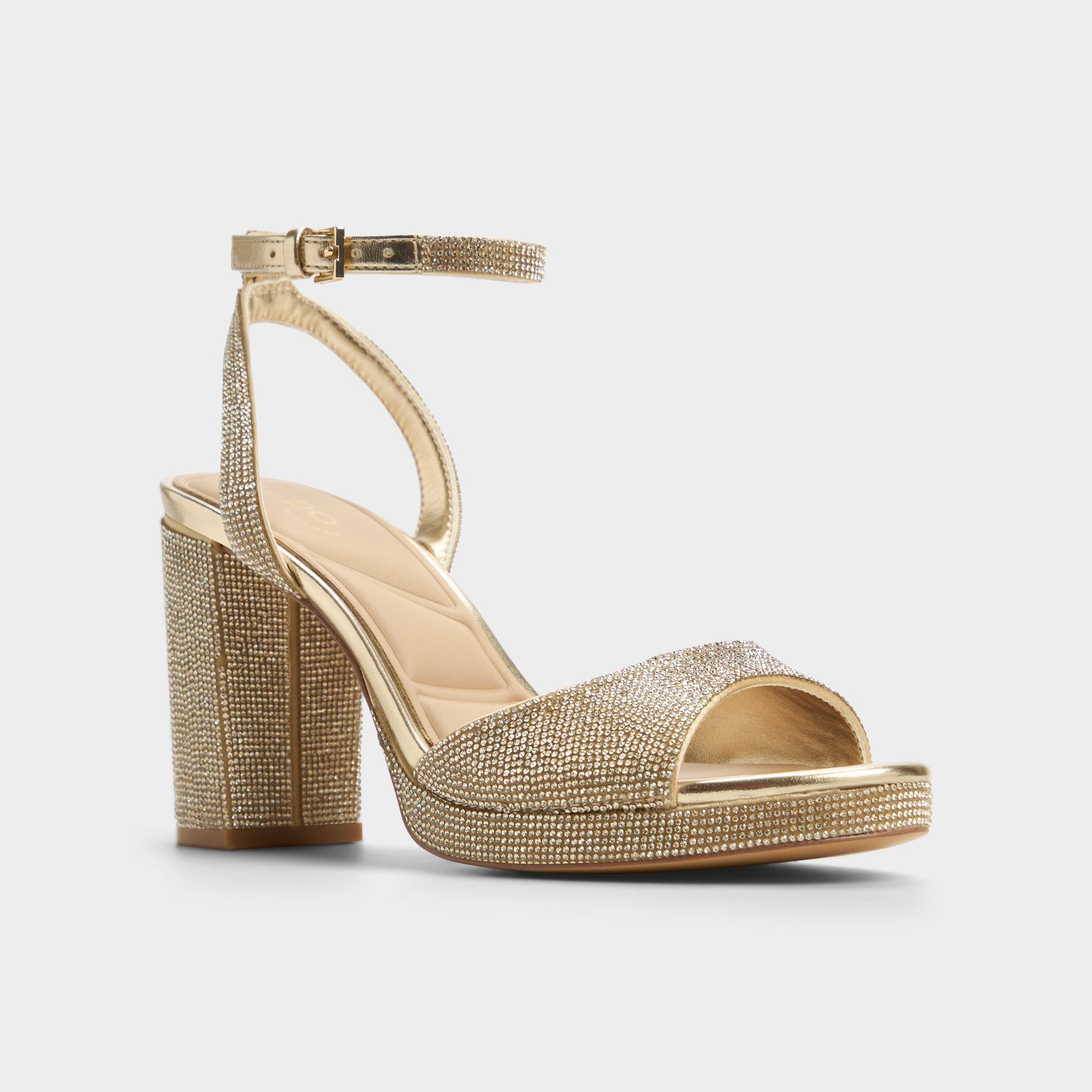Three-quarter angle of Champagne Alluring Strappy heeled sandal's front side