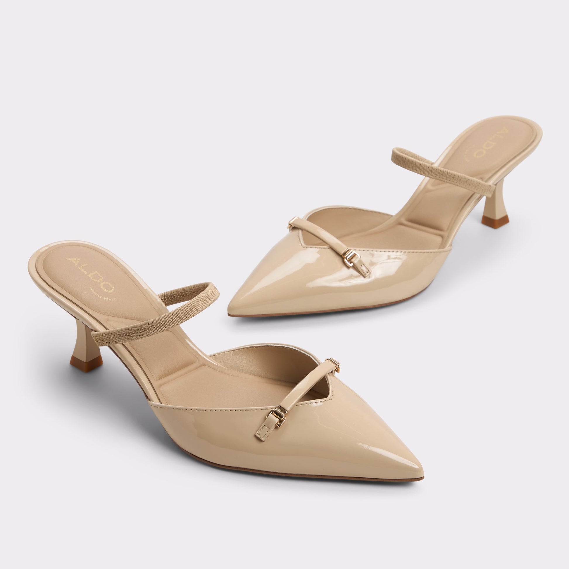 Highlighted view of a pair of Medium beige Nailah Slingback heels