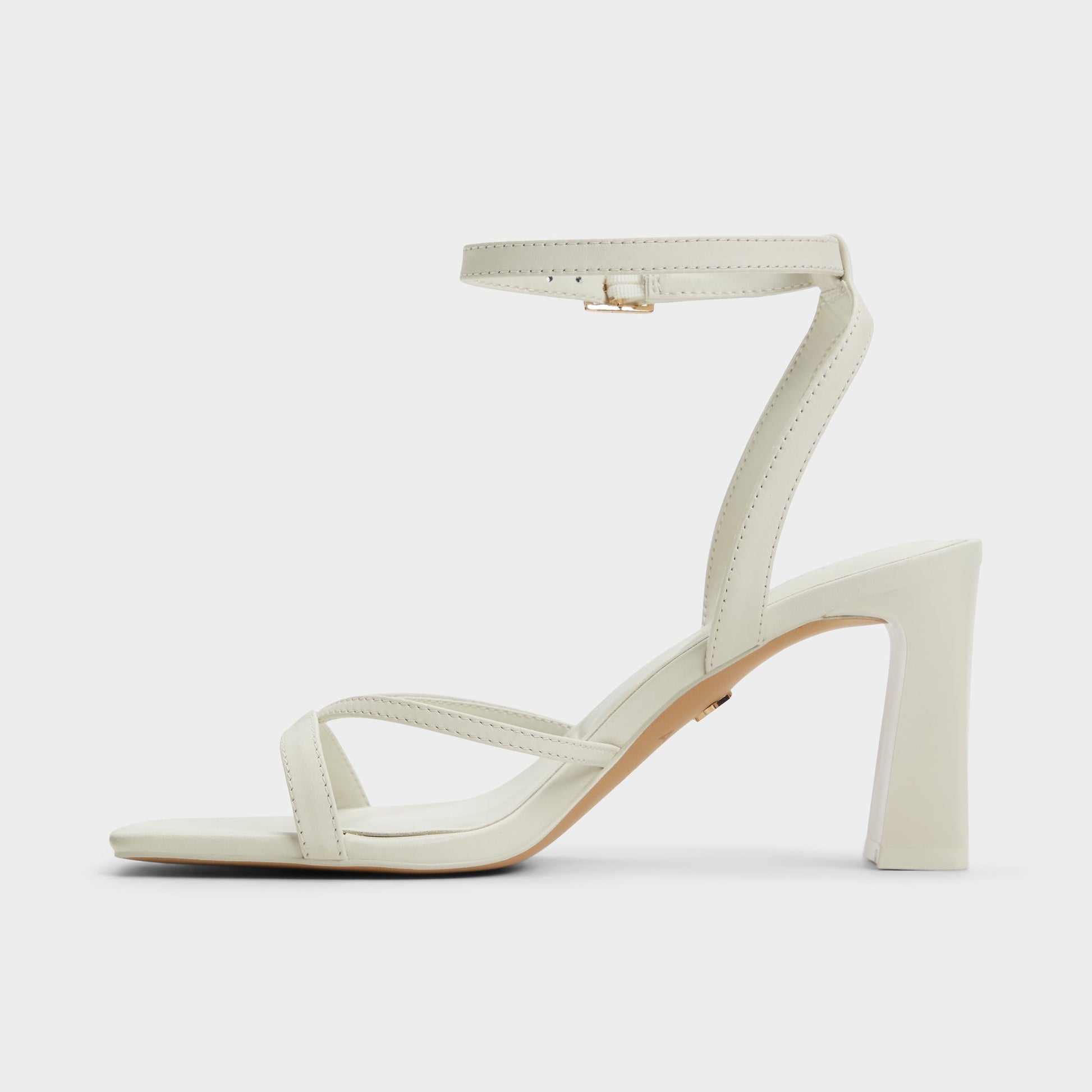Side view of White/Bone Stellare Strappy heeled sandal